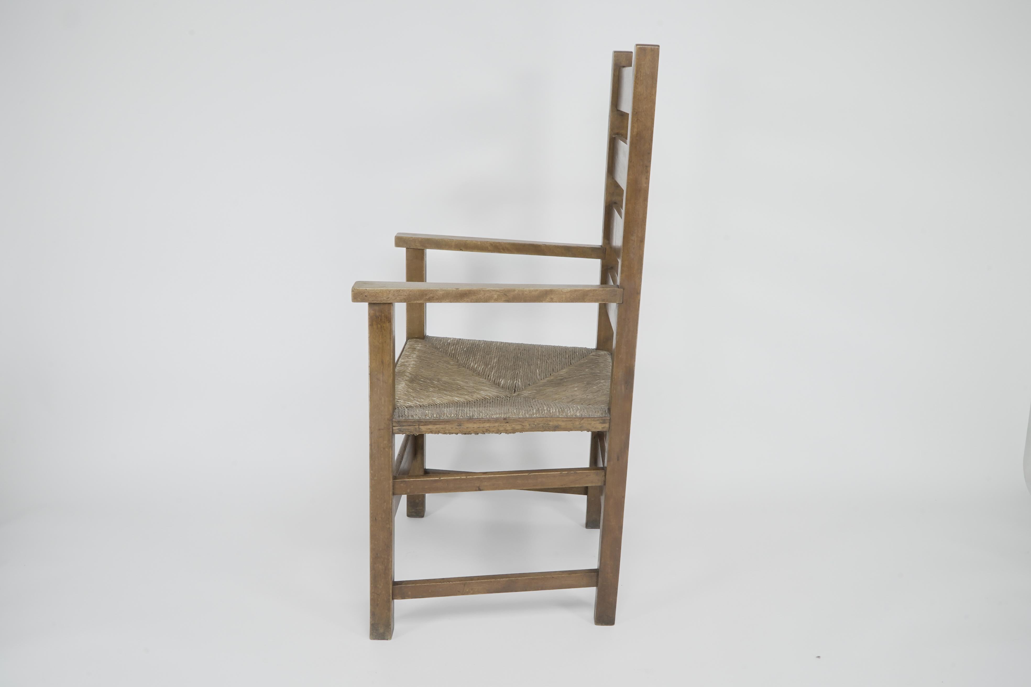 Arts and Crafts Baillie Scott for J P White. Arts & Crafts oak & rush seat ladder back armchair. For Sale