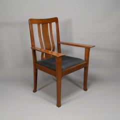 C R Ashbee for The Guild of Handicraft. A rare Arts and Crafts oak armchair