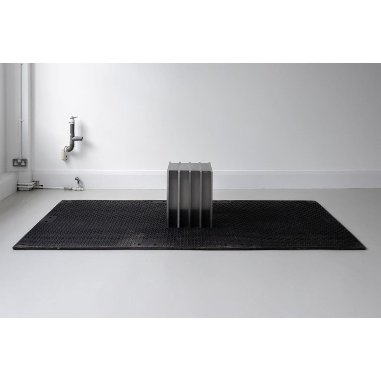 C Series Table by Jaclyn Pappalardo
Dimensions: W 76 x D 40 x H 57 cm
Materials: Precision ground tool steel. 

Jaclyn is a designer and maker based in London. Her background in set design informs her creative work as a designer. Colour and texture