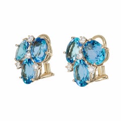 Boucles d'oreilles argentées en or jaune avec topaze bleue de 10,00 carats et diamants