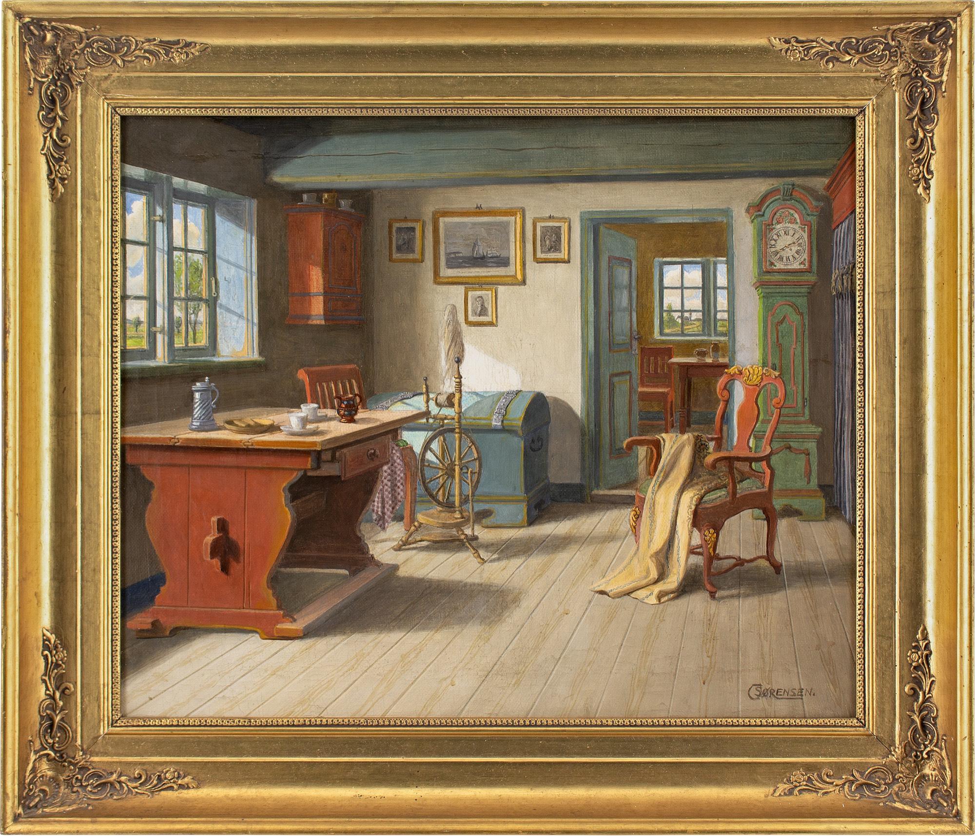 This early 20th-century oil painting by Danish artist C Sorensen depicts a rustic interior with table, spinning wheel, chair, clock, and chest.

Little is known about C Sørensen, which is unusual given their evident skill. They worked predominantly