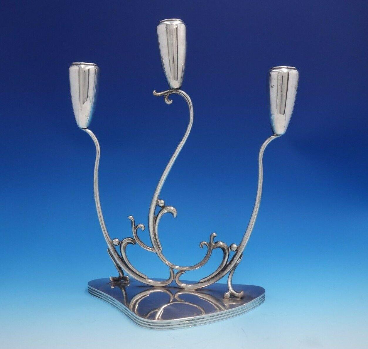 C. Zurita

Stunning C. Zurita .925 silver 3-light candelabra pair with Modern, flowing design. These pieces measures 10