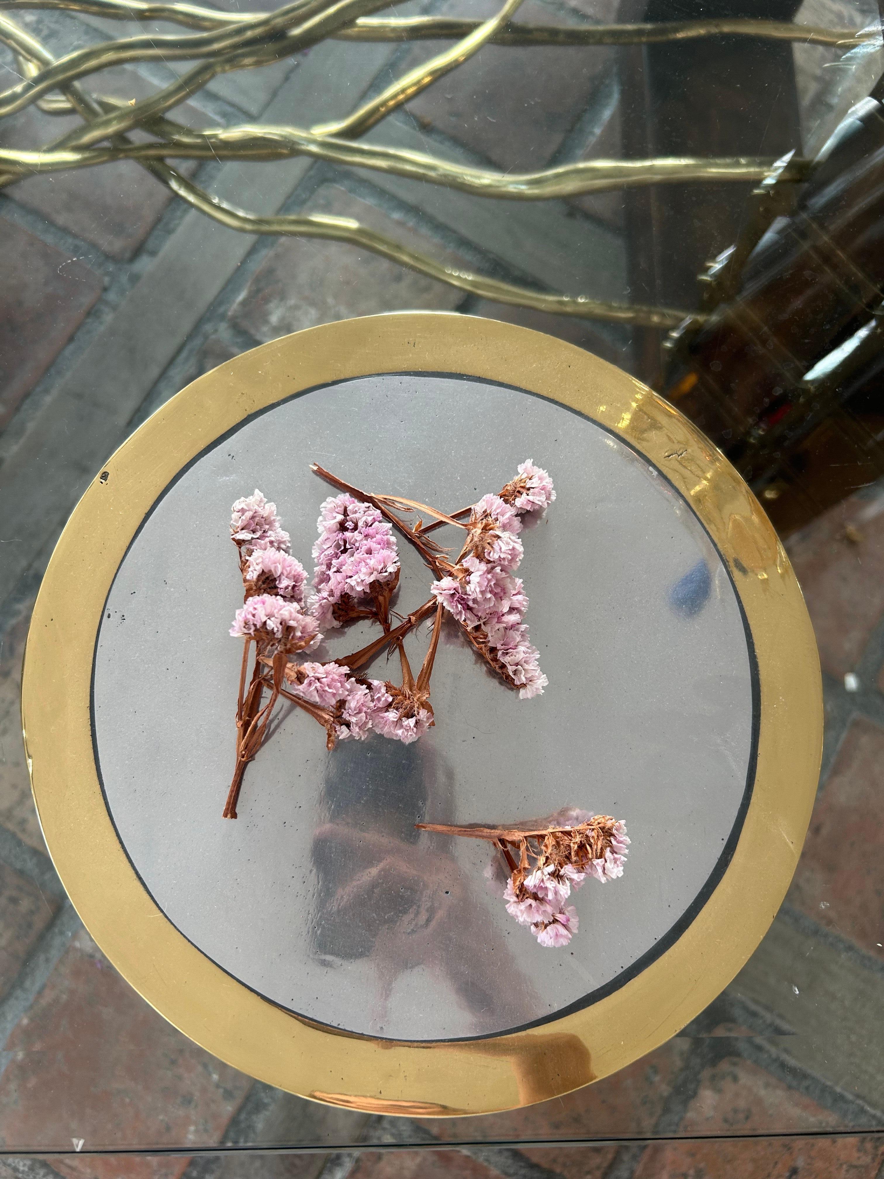
**Decorative Place Mat by David Marshall – Sand Cast Brass & Aluminium**

This striking decorative place mat is a creation by renowned artist David Marshall. Crafted using the sand casting technique in solid brass and aluminium, each piece is