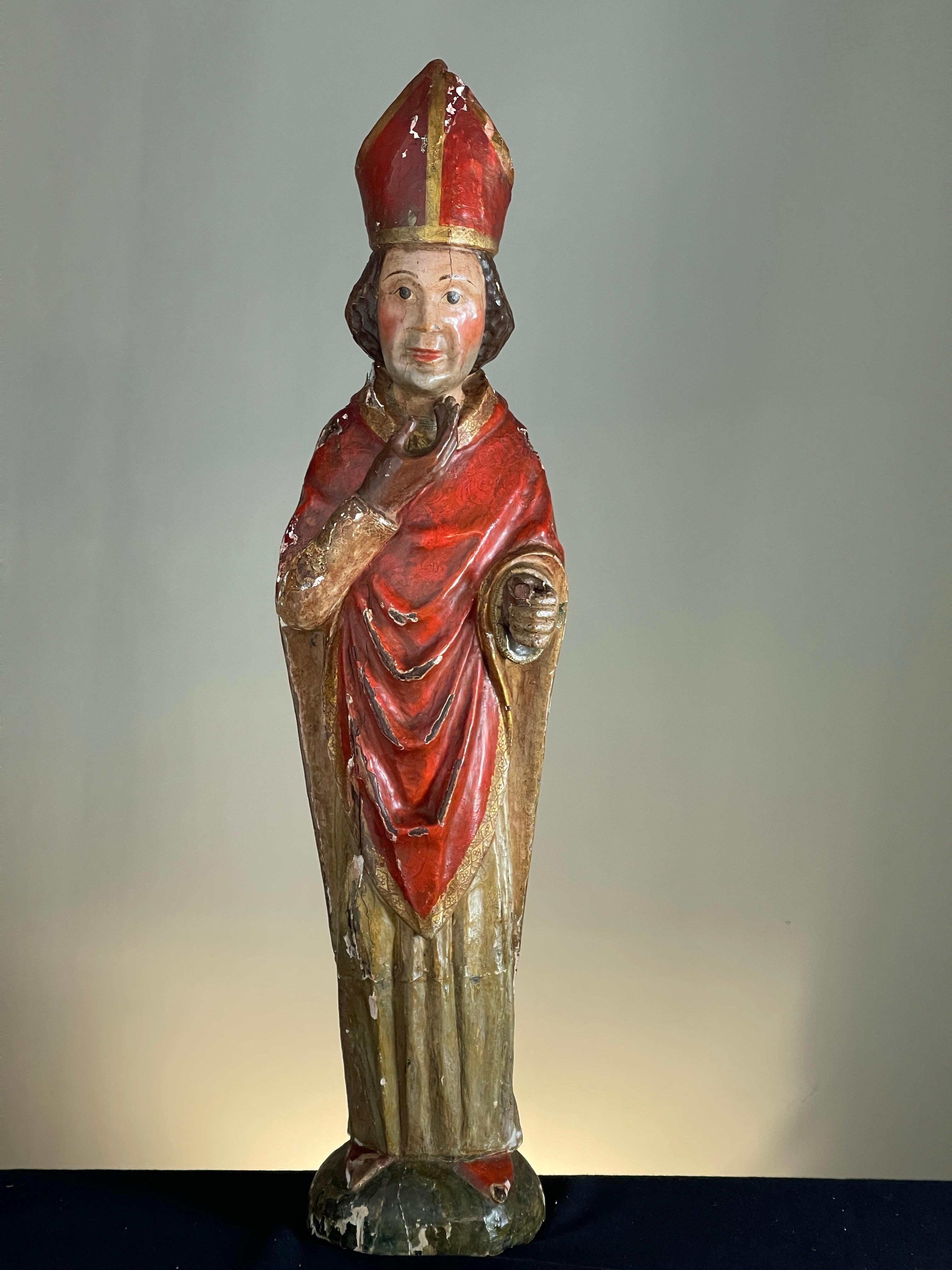 C1600 wood carving of a cardinal with good original polychrome decoration
