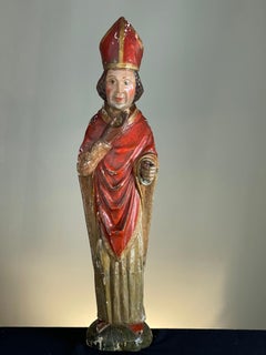 C1600 wood carving of a cardinal
