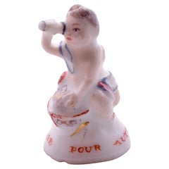 Antique C1745, Chelsea Porcelain Seal Seated Cupid with Spy-Glass, Charles Gouyn Period