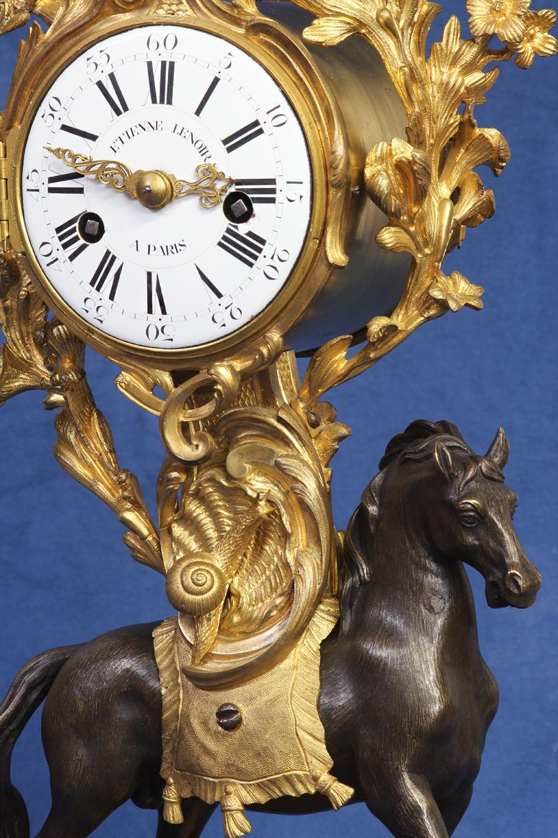 Maker: 
Etienne Lenoir

Case: 
The ormolu and patinated case features a prancing horse with a finely textured finish, a wellcast snail, scrolling foliage above framing the clock and a cast and textured base.

Dial: 
The finely painted white