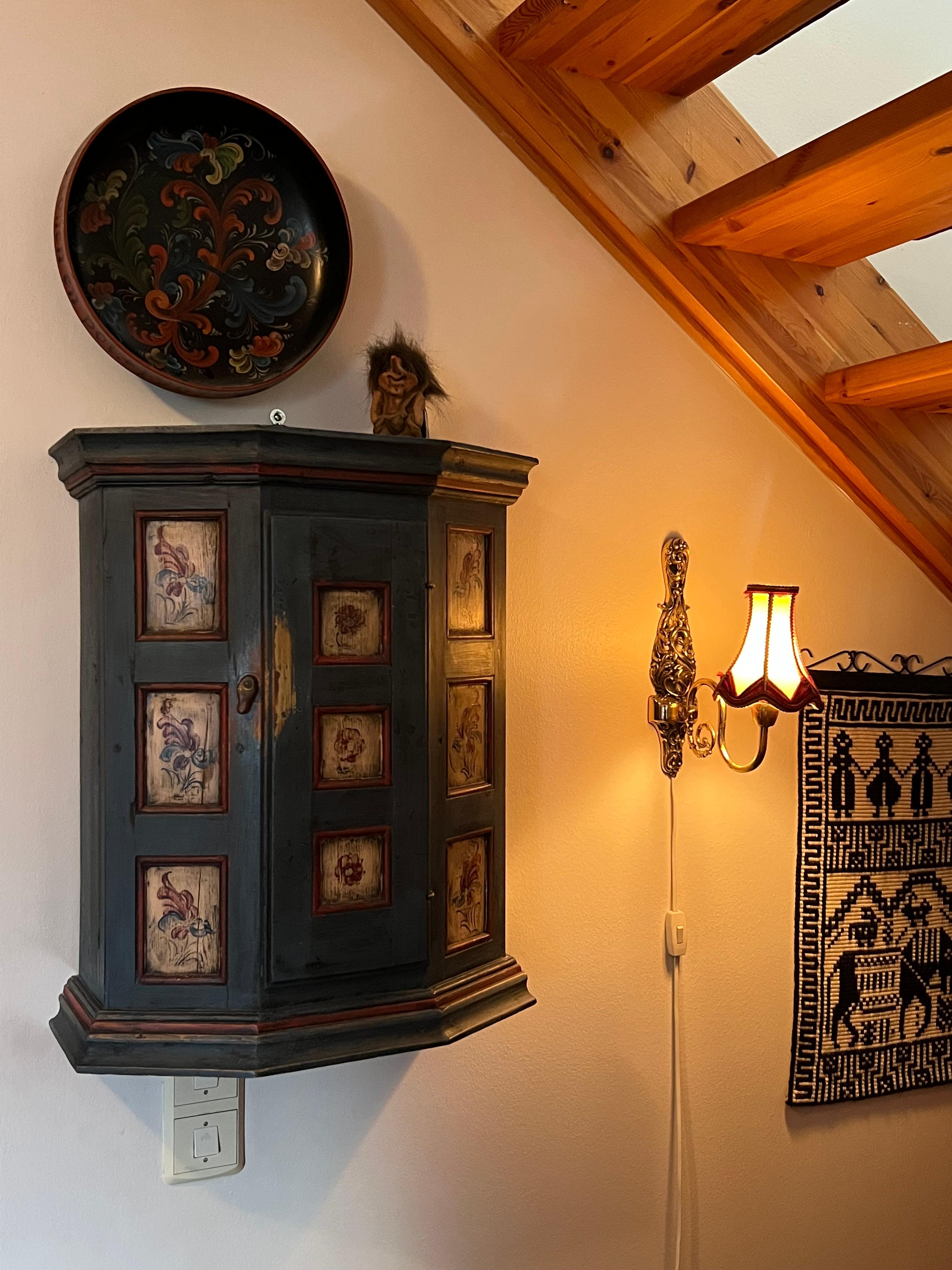 A small c.18/1900s Norwegian Rosemaling Baroque Cabinet - Hand-Painted Pine

This charming baroque-style cabinet is handcrafted from solid pine and features traditional farmhouse blue base color with stunning Telemark rosemaling floral patterns. The