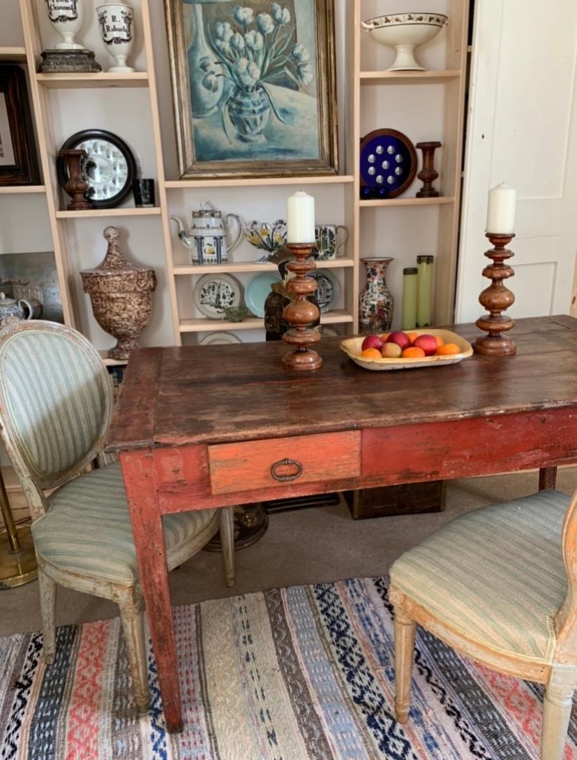 French Country house table original paint in a a lovely red tone.
Has two large drawers (side & top) featuring iron pull handles.