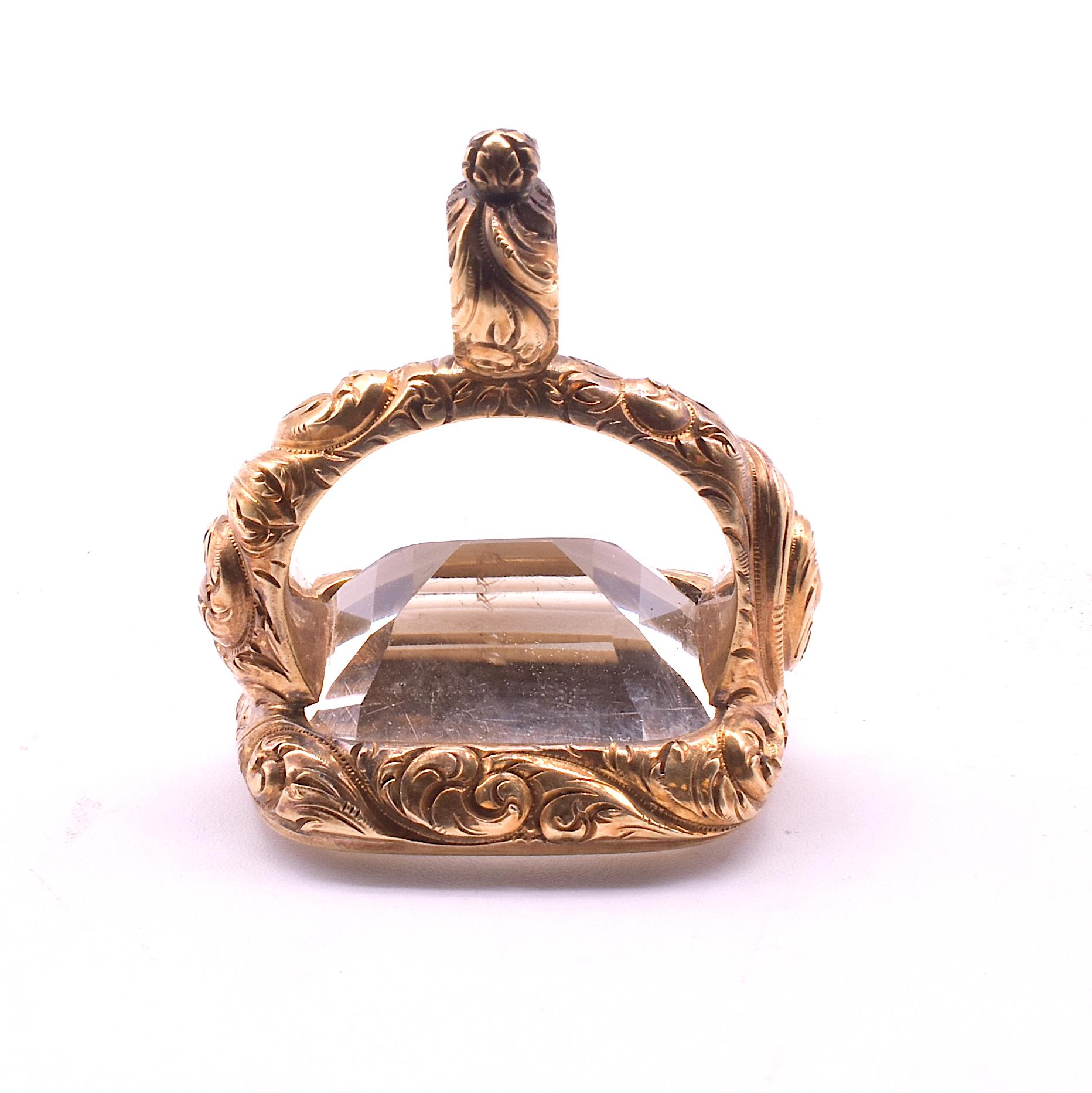 Georgian chased fob of 15K in the shape of a stirrup cup with a chased built in bale for hanging from your favorite pendant. The fob is filled with clear unadorned citrine. With the gold-work chased on every surface, this is a fob to behold. A nice