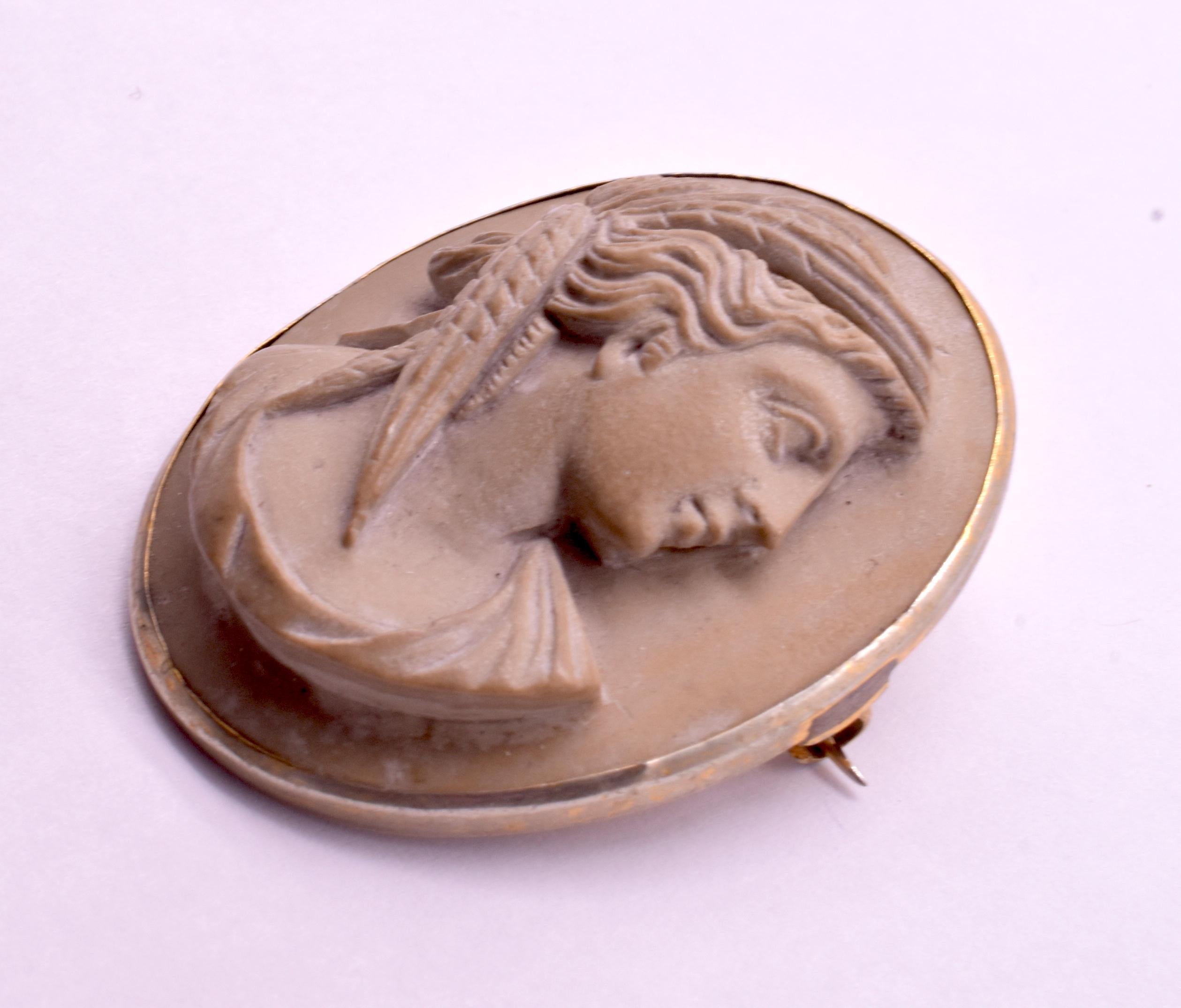 Finely carved brooch of the goddess Demeter (Roman: Ceres), goddess of agriculture, her hair wrapped in what appears to be a scarf of grain or corn. The important Greek goddesses were a popular theme in cameo carvings of the 19th century, with