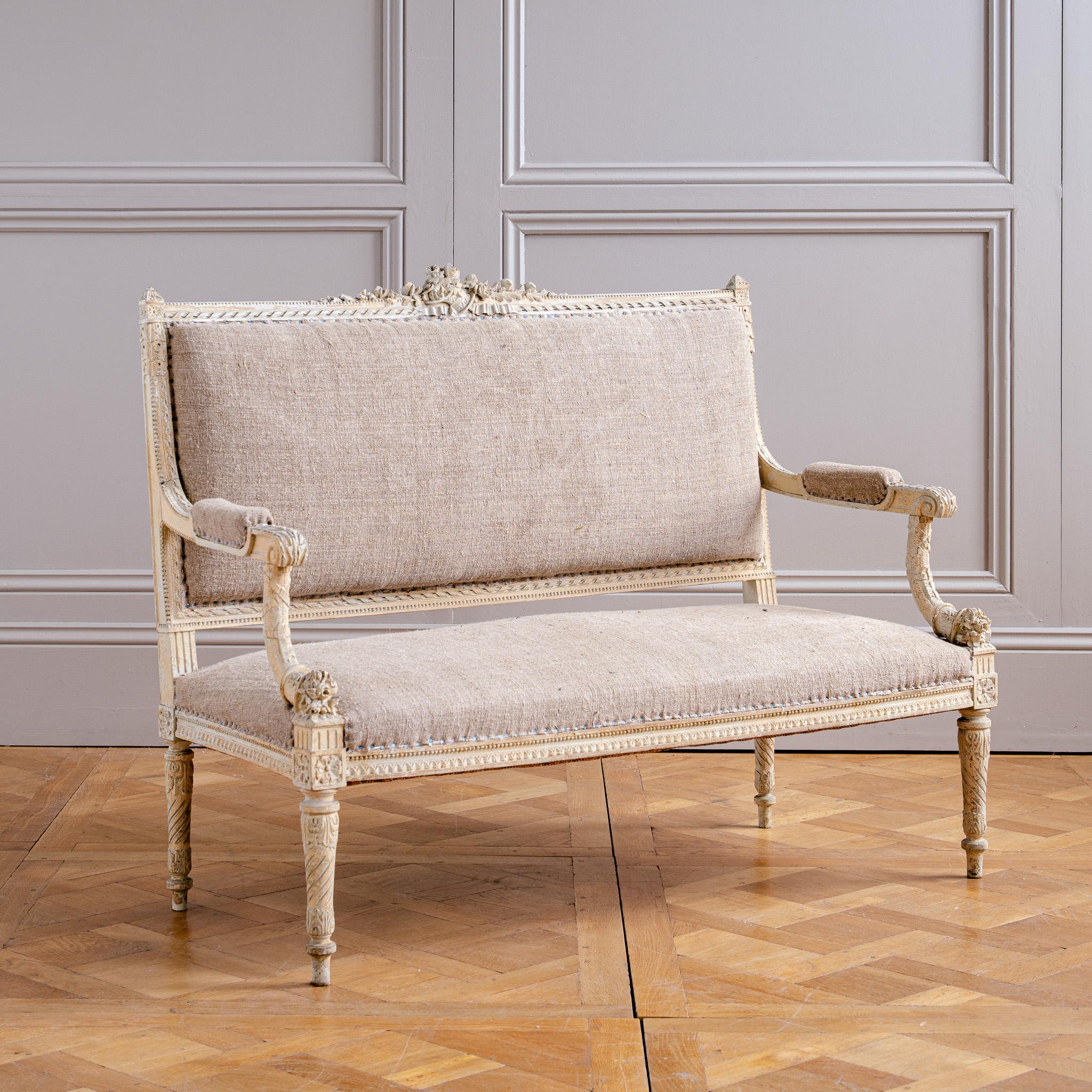 A finely hand carved French two-seater canapé à dossier droit (straight-back sofa) from the Second Empire period (c.1860), reflecting the Louis XVI revival style that reimagined the neoclassical grace of the late 18th century (circa