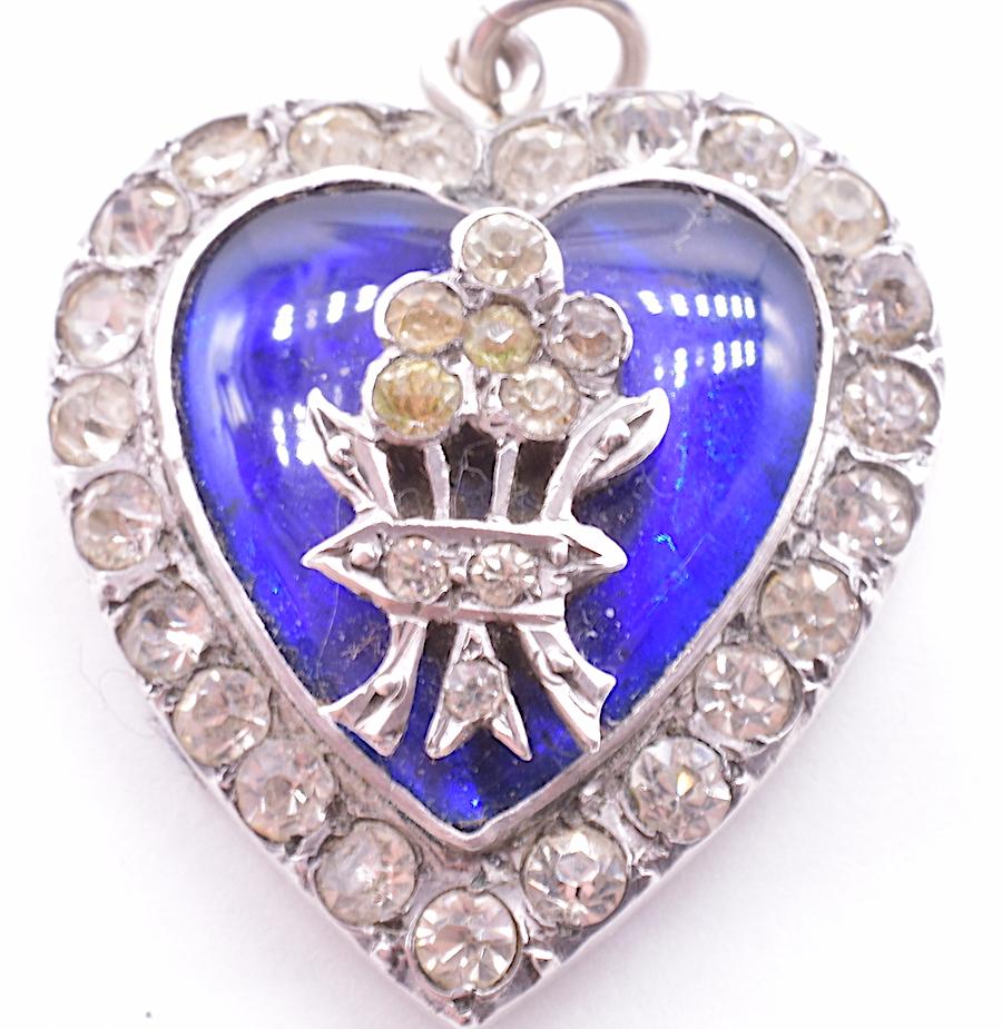 Lovely early Victorian sterling silver paste pendant with a border of paste stones and royal blue enamel, most likely was a pendant given as a gift to a loved one. The beautiful blue color represented innocence and virtue and was probably given to a