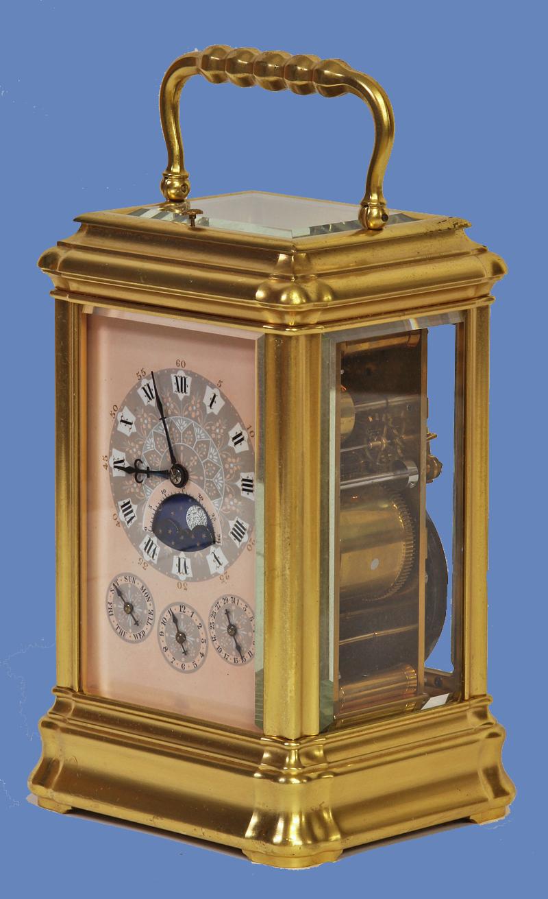 Case: 
The large gilt-bronze gorge style case has crisp molded edges, beveled glasses to five sides and a hinged handle above.

Dial: 
The pink porcelain dial has decorative grey and light blue fields for the main and subsidiary dials that