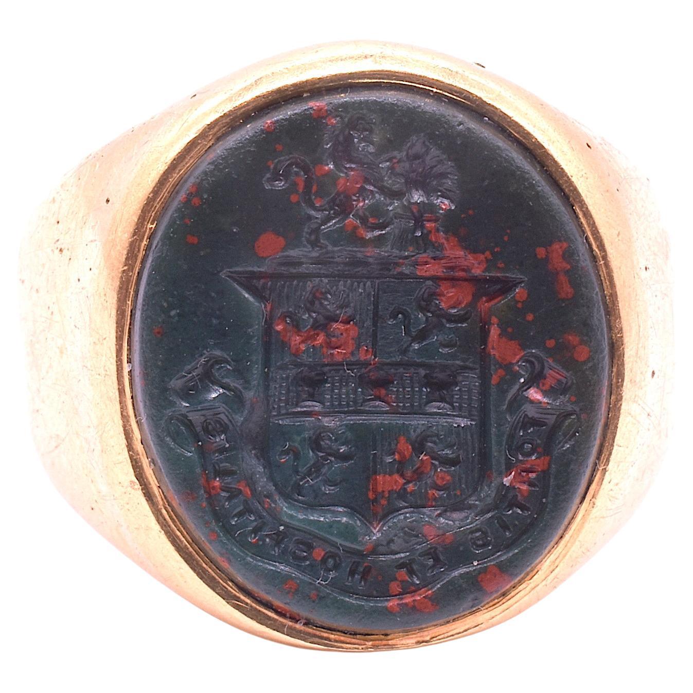 Antique 15K signet ring for the Murphy surname with motto and crest carved in bloodstone. Bloodstone is a hard-stone of dark green chalcedony with a smattering of red specks. Atop stands the Lion Rampant in profile holding the wheat sheaf between
