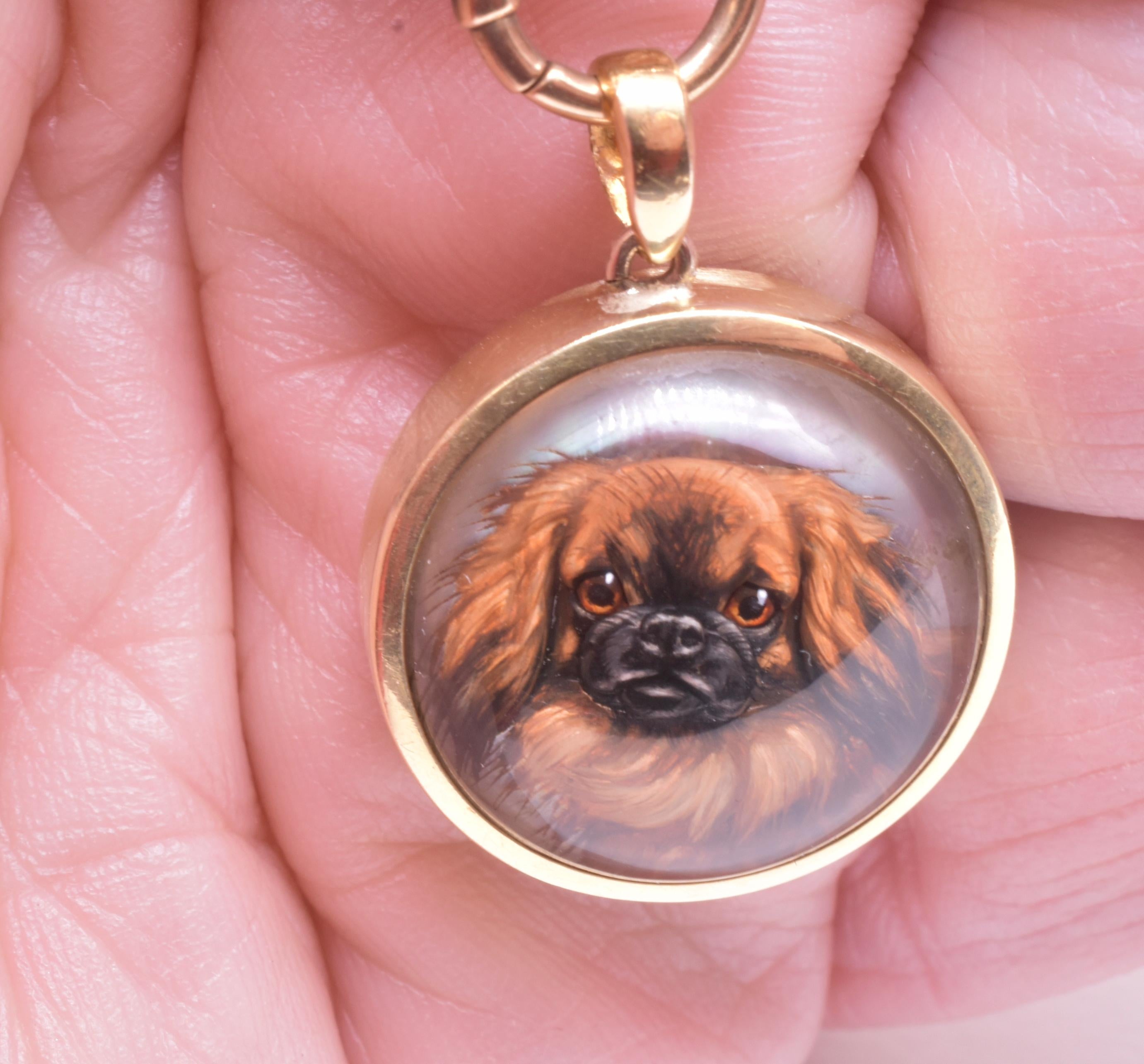 18K pendant of rock crystal with a reverse intaglio of a realistically and beautifully rendered adorable Pekingese. The pendant has an integral matching bale. The reverse side has an inscription which reads: Ed. Van den Hove & Fils, Bruxelles, C.
