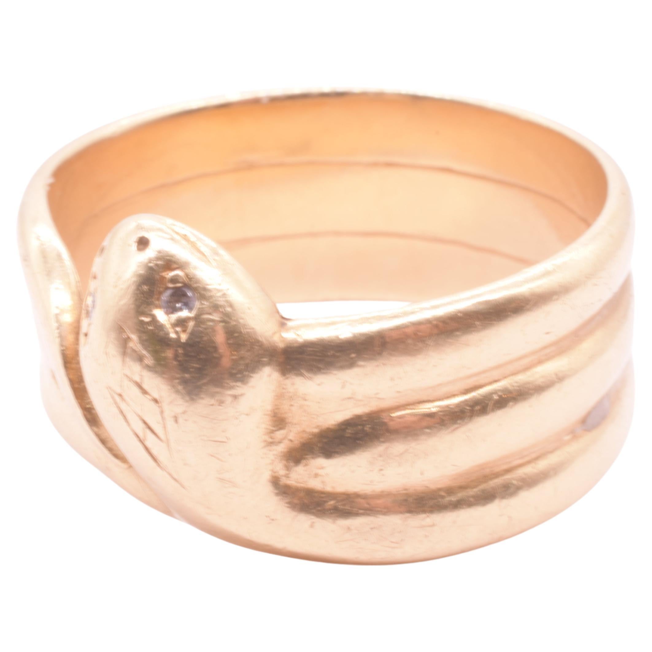 Substantial 18K antique triple banded Victorian snake ring set with 2 diamonds as the snake's eyes, lightly engraved scale marks at the top of the head, a curving tail and derpy smile. All the things we look for in a snake ring! 

Snakes were a