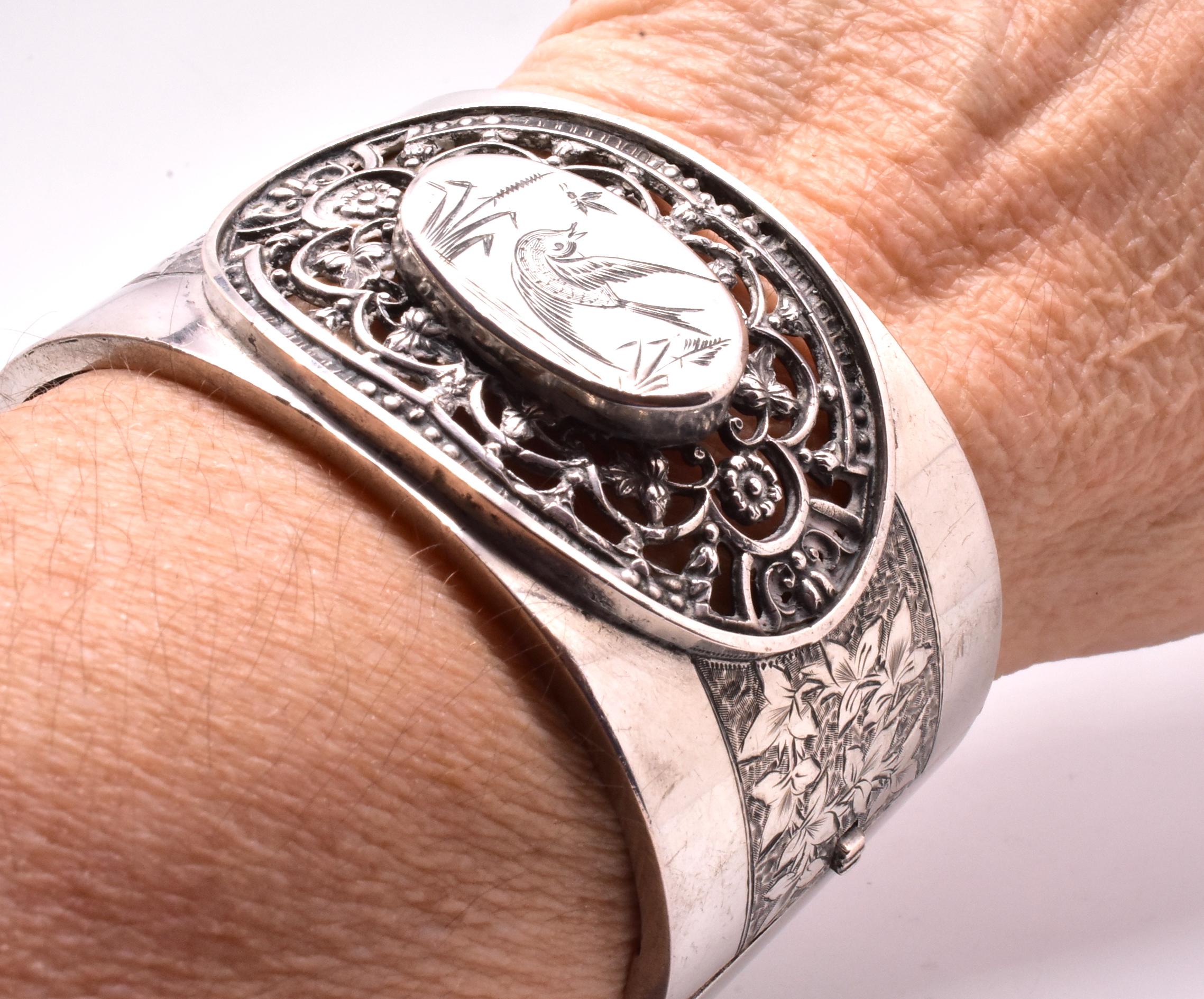 Aesthetic Movement Sterling Cuff Bracelet with Birds in an Open Cutwork Border, circa 1880 For Sale