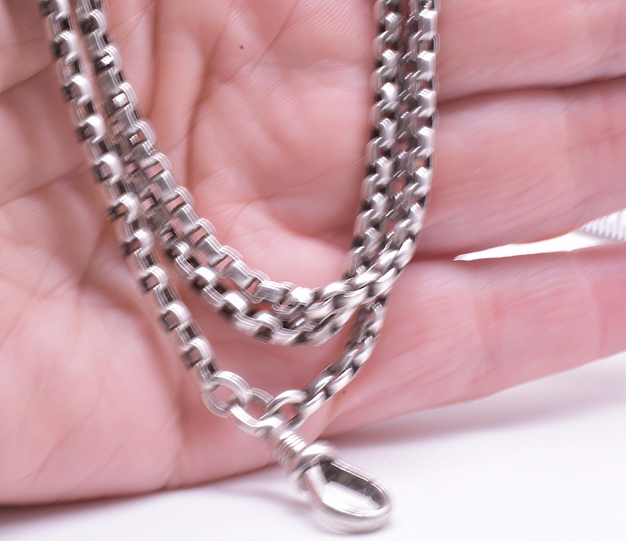 This is an original nineteenth century sterling watch chain with a substantial square shaped link called a Venetian or box link. Closeup photos reveal the interesting interlocking pattern of the links. A great deal of ingenuity went into making