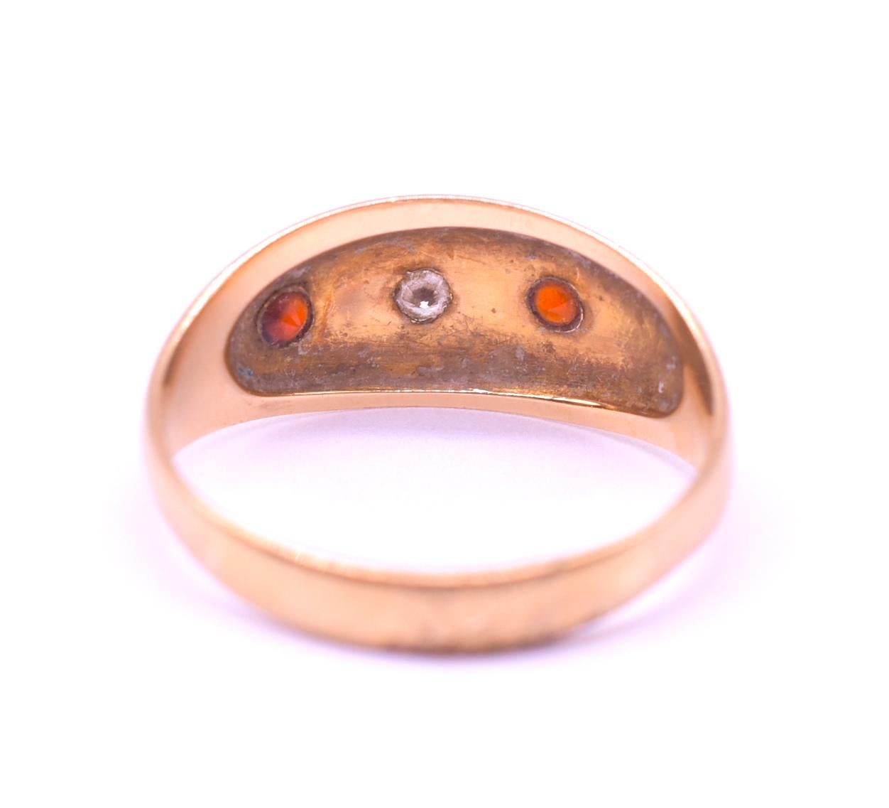 Antique Gypsy Ring with two garnets and 1 star set diamond  encased in clear 8 pointed stars on a polished 18K band.  Gypsy rings settings are of the most secure for gemstones and are worn by people with active lifestyles, men and women alike. Their
