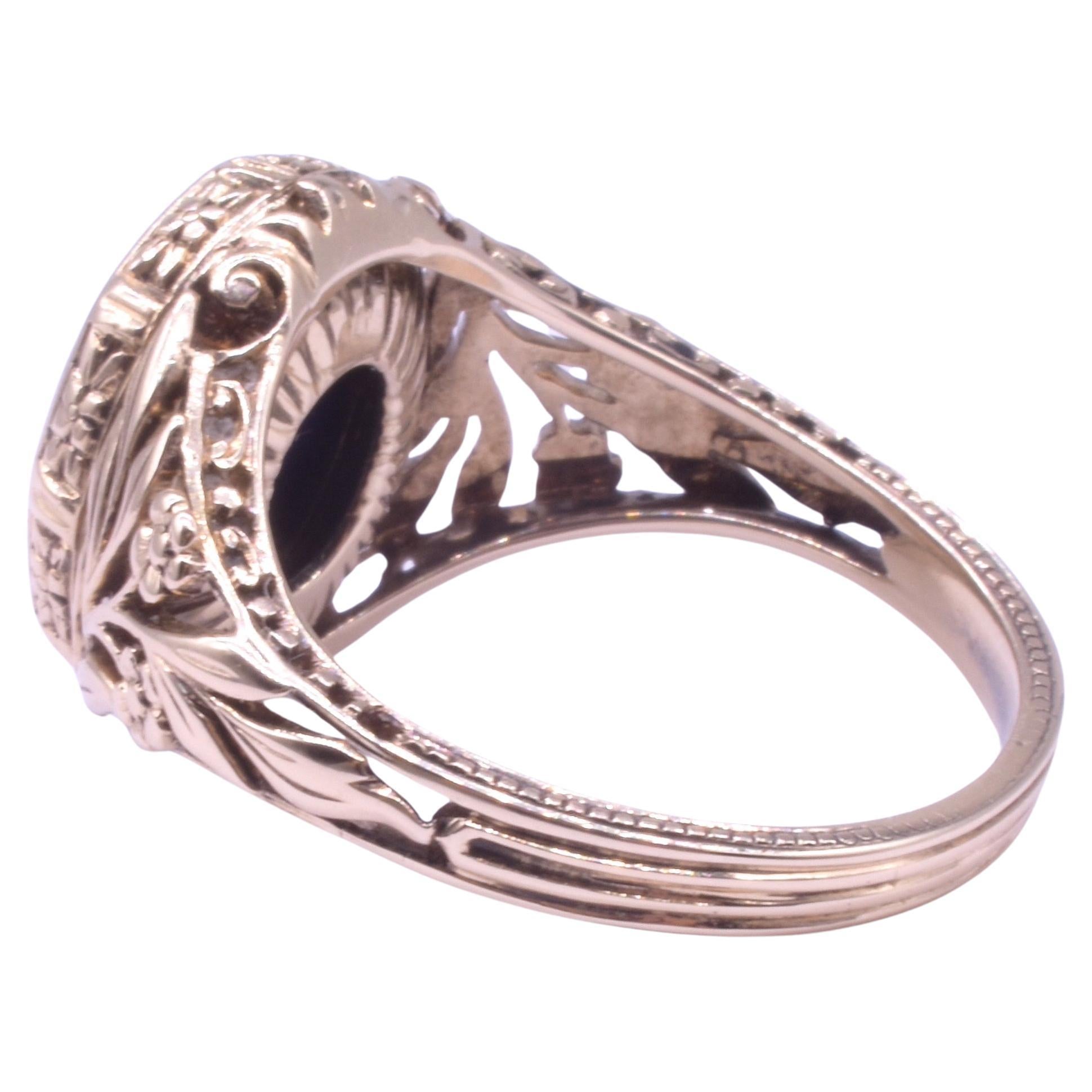 With its openwork shoulders of carved flowers and leaves that culminate into a reeded band, this 14K monogrammed signet ring is particularly enchanting. The monogrammed letters 