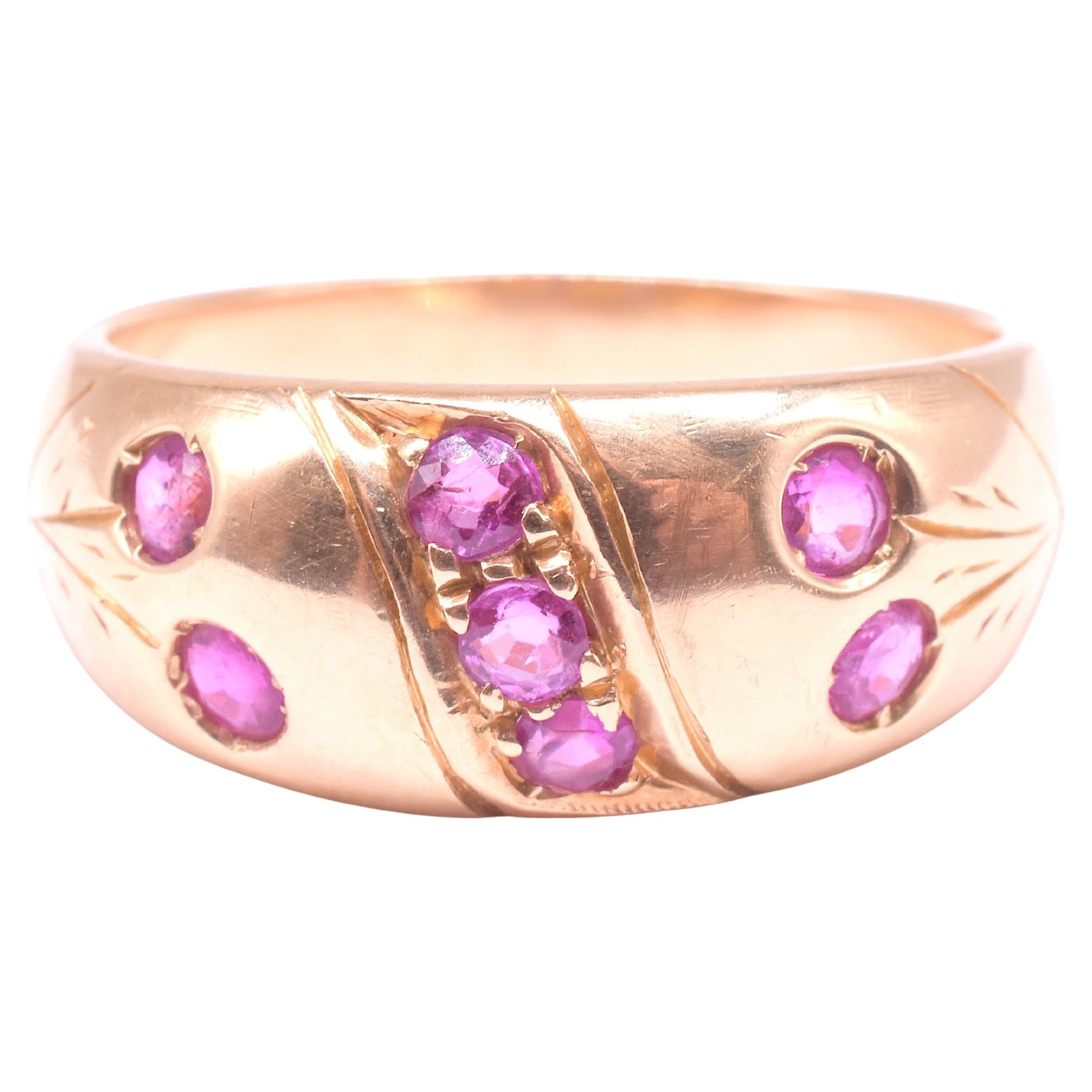 What makes this gypsy ring unique? So many things! 

We could start with the wonderful burma rubies. 

Or we could mention the clever way the goldsmith incised (hand-carved) lines in the gold to suggest stems with the rubies as the flower. Or