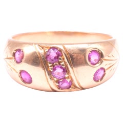 C1900 18K Ruby Gypsy Ring with Buckle Design and Carved Flower Stems