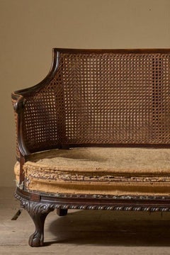 c.1900 Bergere sofa with shapely arms