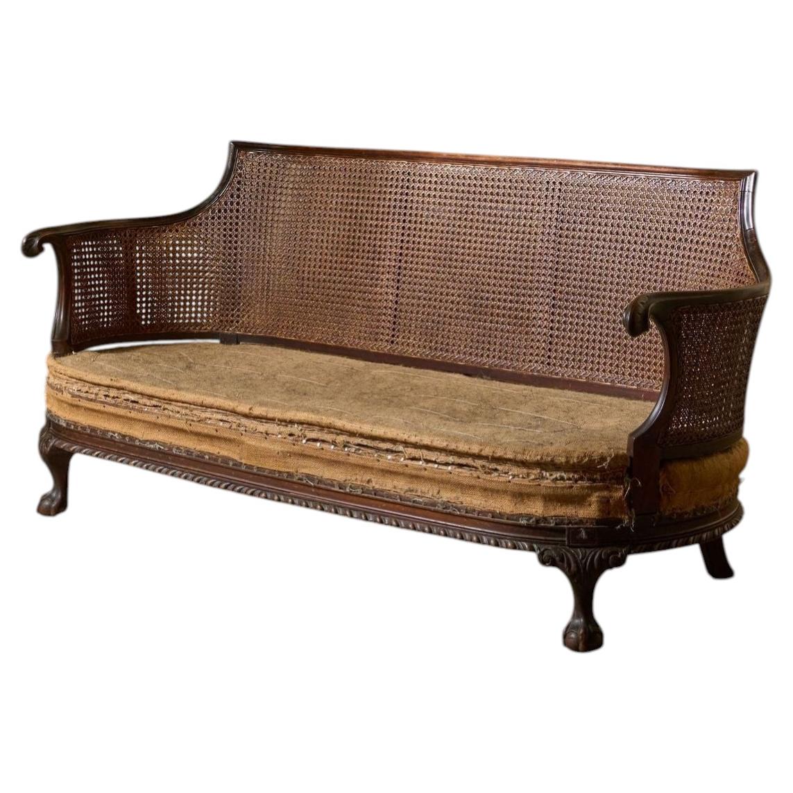 c.1900 Bergere sofa with shapely arms For Sale