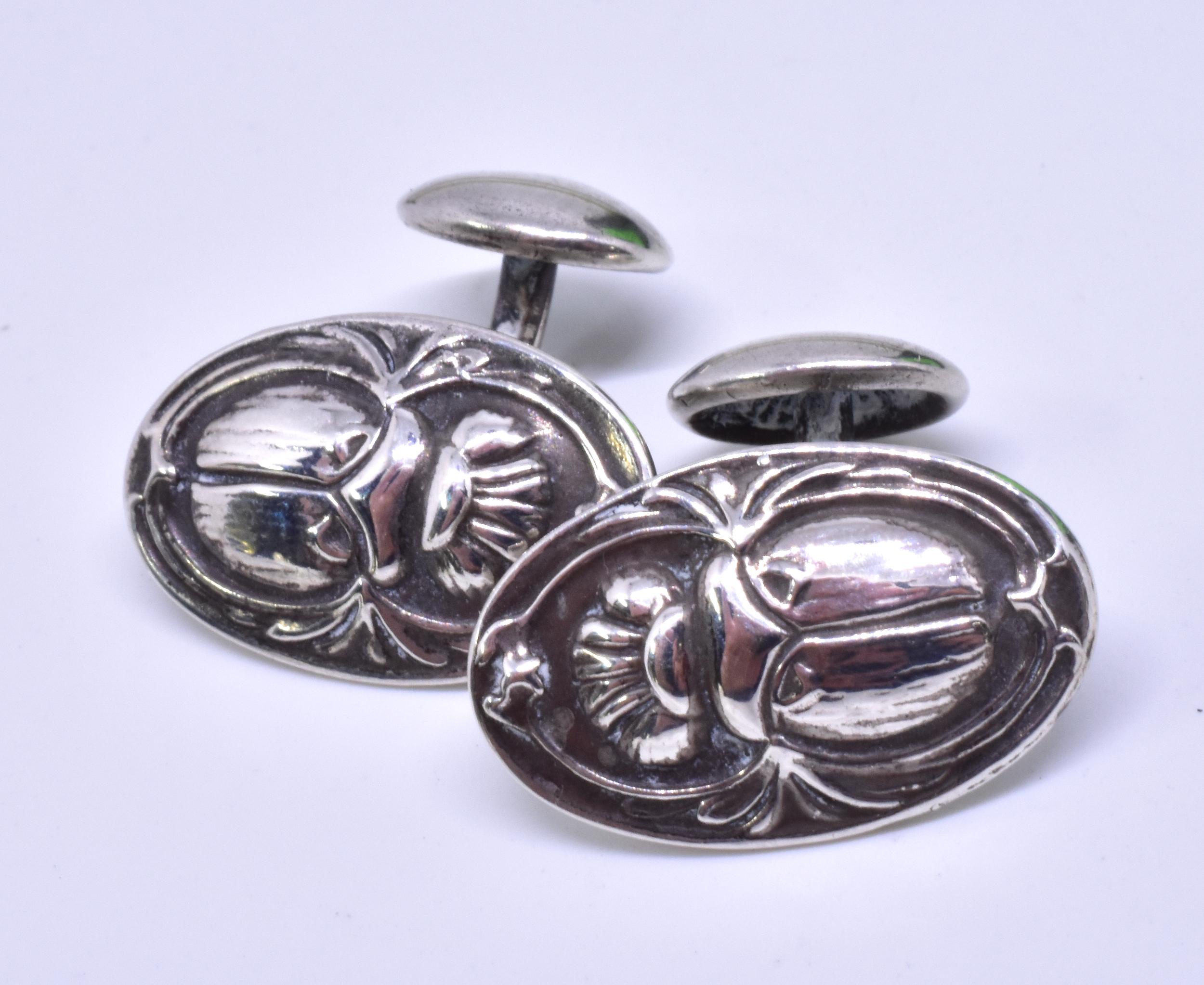 These beautifully crafted Egyptian revival cufflinks of sterling silver scarab beetles are the creation of Herman and Eugene Unger, German immigrants who settled in Newark, NJ and were a part of the immensely creative Art Nouveau period at the turn