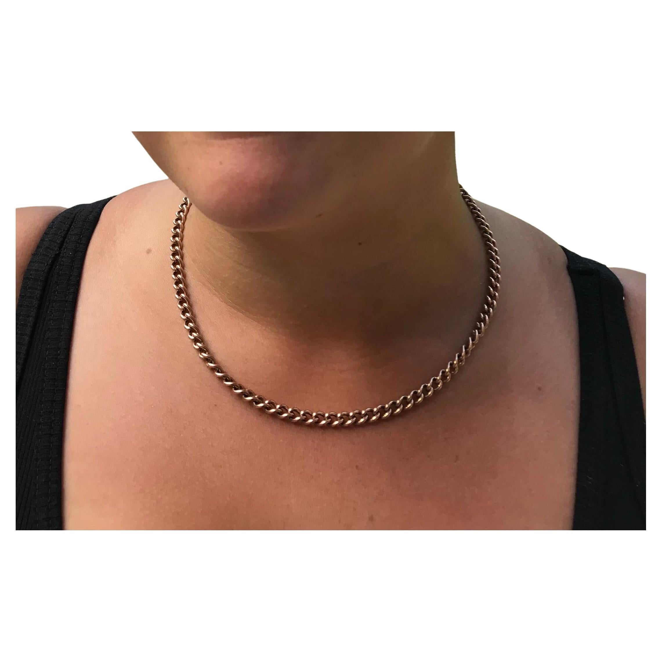 An essential chain for one's jewelry collection, this 18 inch long 9k Albert curb link chain has 2 dog clips attached for use as a clasp or to hang a pendant from. Each individual link and dog clip is individually stamped 9 and 375 (for 9K).