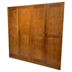 Armario inglés de roble de cuatro puertas del siglo XIX