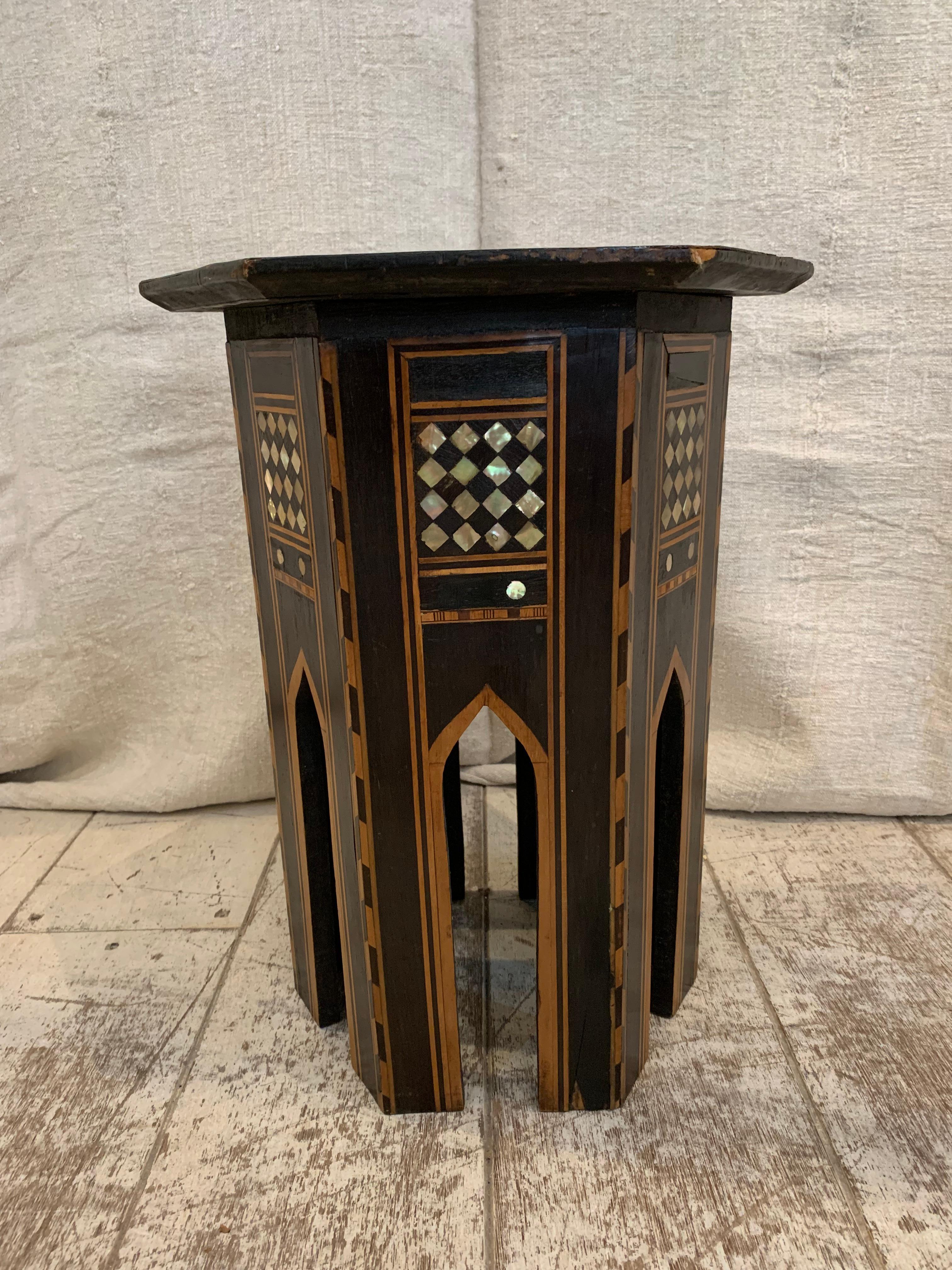 A nice little Damascan hexagonal side table from circa 1900s.
It features the typical characteristics of Middle Eastern design often associated with Moorish and Syrian influences of mother of pear inlay.
There is general wear and tear commensurate