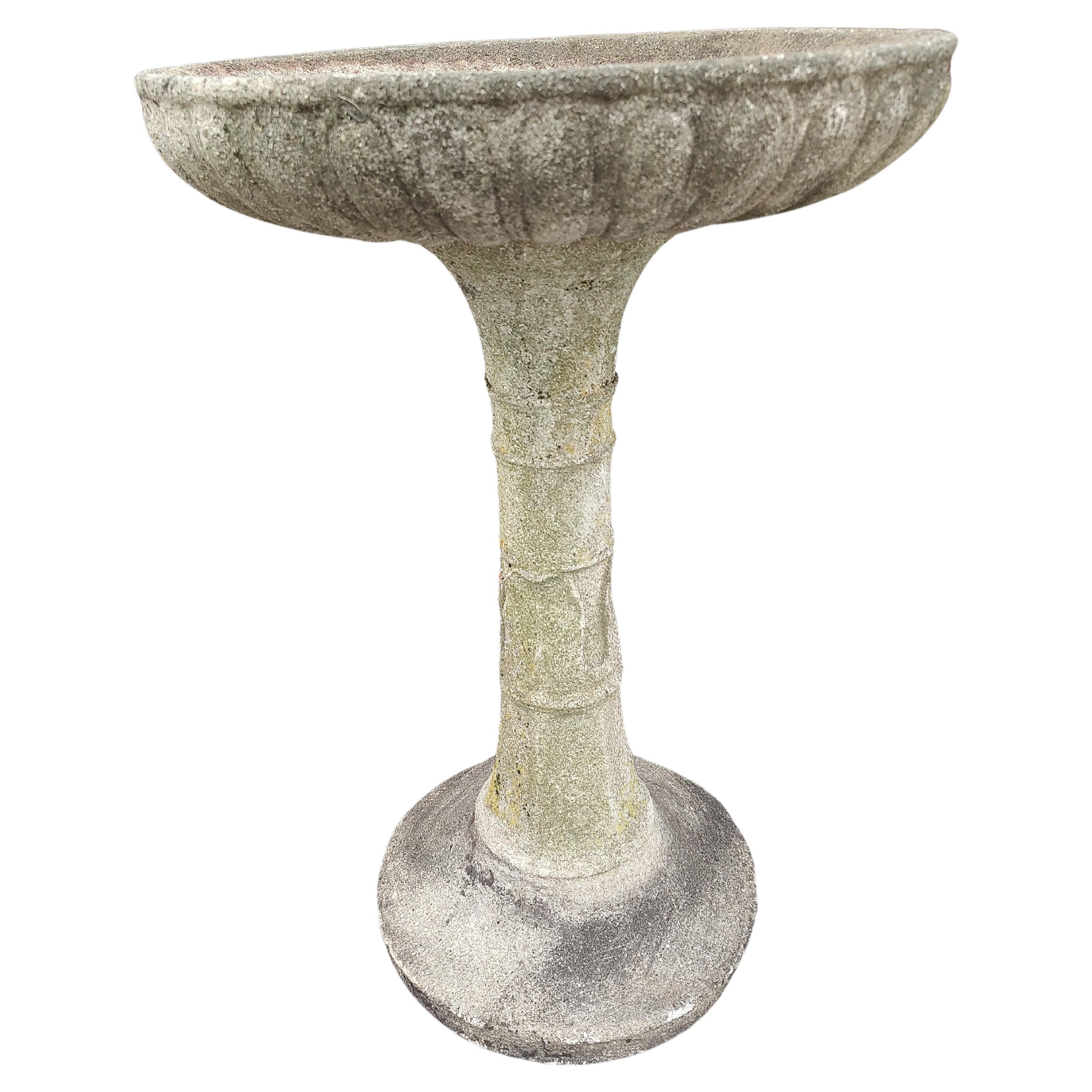 Beautiful 2 piece cast stone birdbath wit a magnificent patina. Minor crack in the basin which we are going to silicone. Holds water. Other than that it's in excellent condition with age related wear.