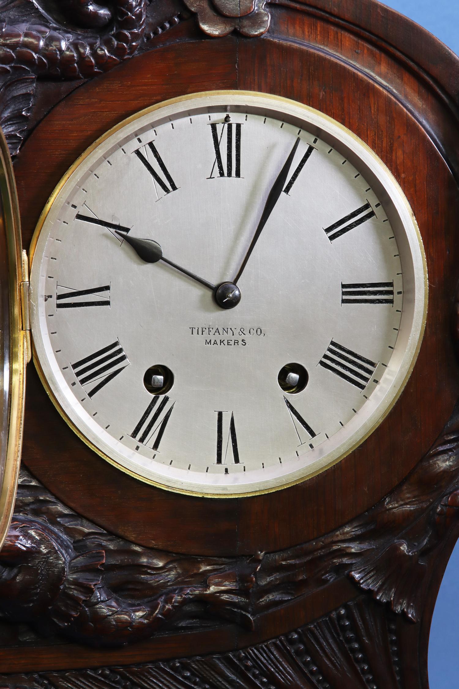 c.1910 Rare Double Dial Clock with Perpetual Calendar by Tiffany & Co., Makers.

g178

Tiffany & Co., Makers, New York.

The shaped oak case is decorated with carved sea serpents and houses the clock and perpetual calendar side by side.

The