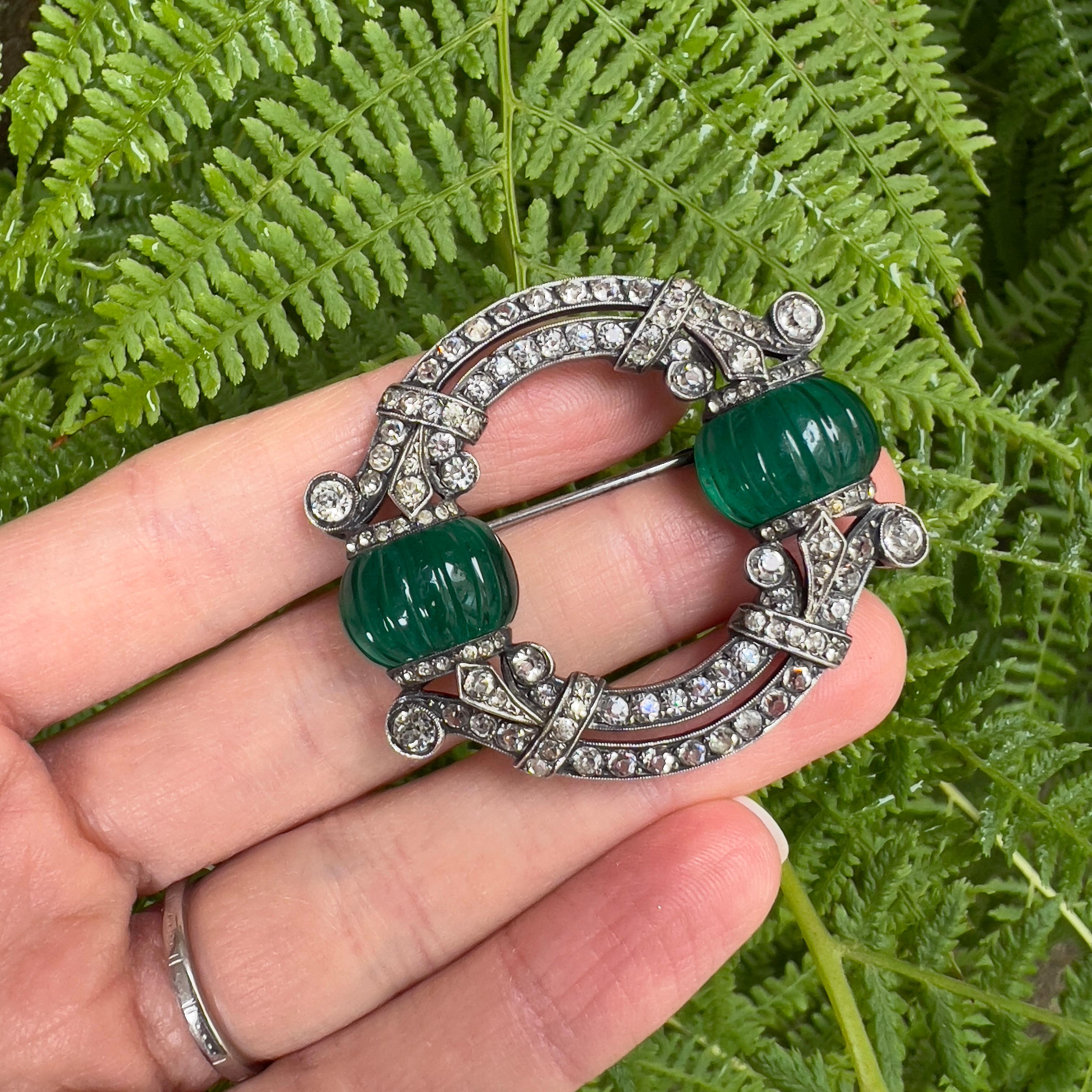 This brooch is the ultimate expression of early Art Deco design. Of impeccable quality and in outstanding condition, it was created in French and features rare melon cut glass. 

Condition Report:
Excellent

The Details...
This brooch is constructed