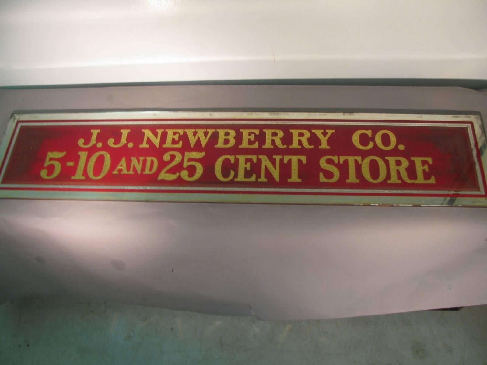 Fabulous double sided reverse painted with gilt lettering sign from a JJ Newberry store in my hometown of Port Jervis NY. Pair of signs available which were originally mounted over the doorways. Glass signs are in excellent condition. Some fading