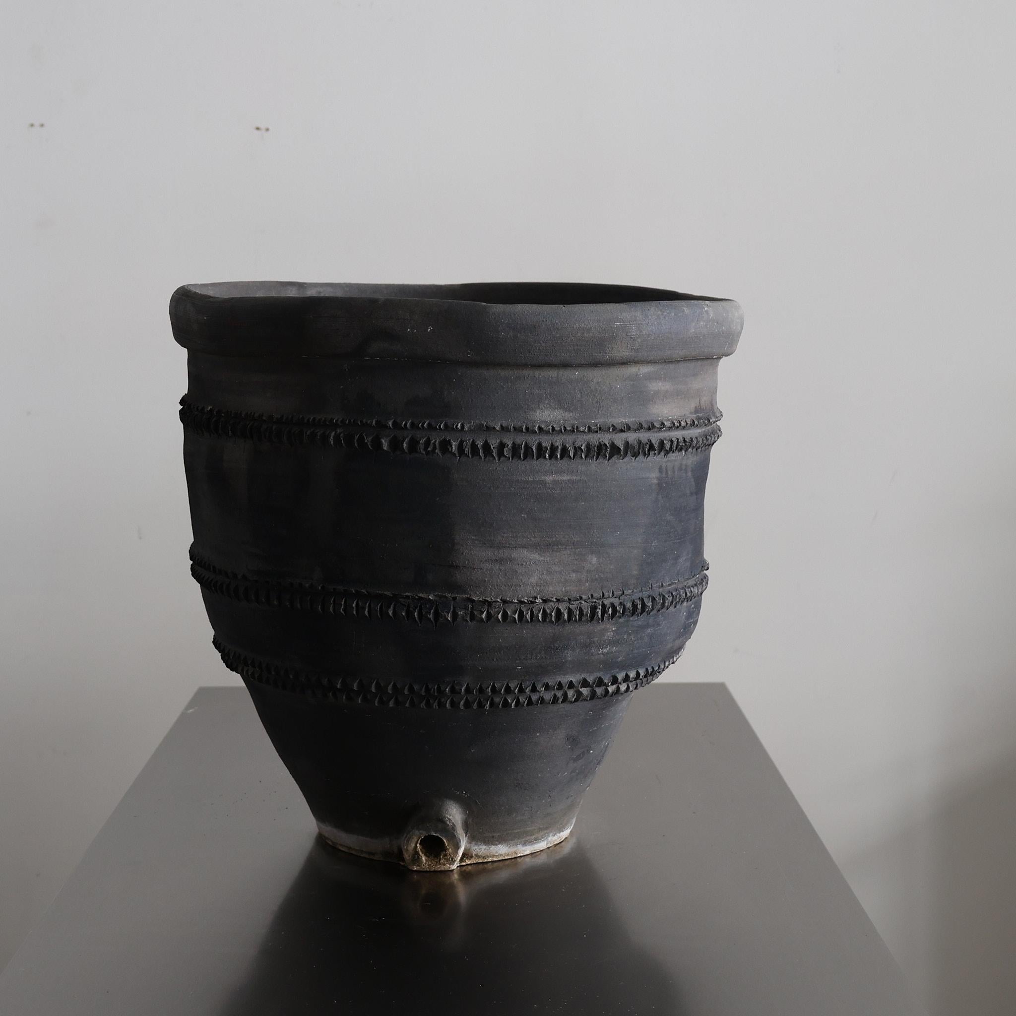 A C.1920s black Catalan terracotta cosi pot from the village of Quart.

Originally used for the storage of wine &/or olive oil.

Nicely patinated due to 100 years of use.

Part of a recently purchased collection of eight from the same village.
