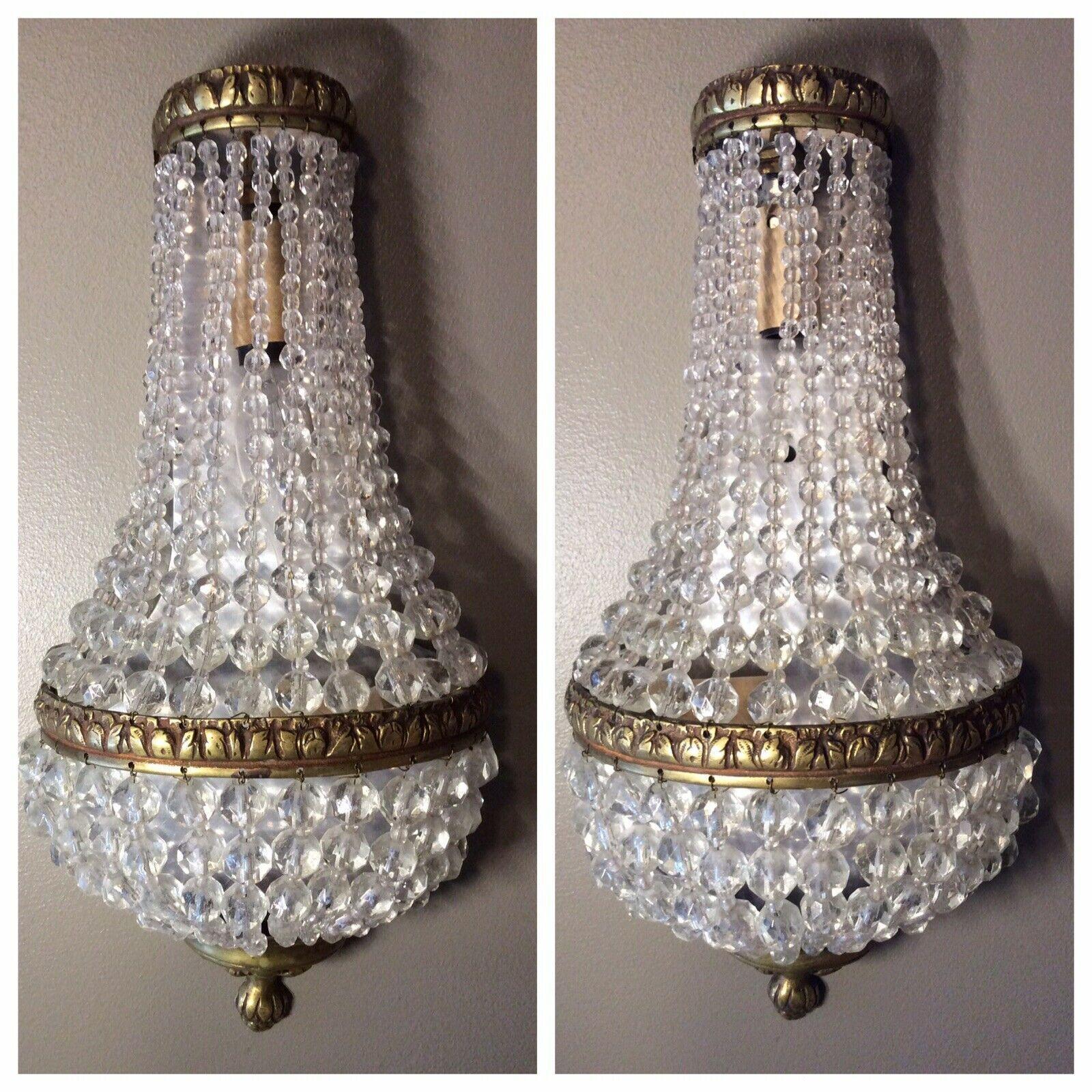 What makes this pair of cascading crystal different? These are authentic 1920's. Pair of 1920's Cut Crystal Bag and Tent / Empire style Wall Sconces. Bronze framed. All intact and original.