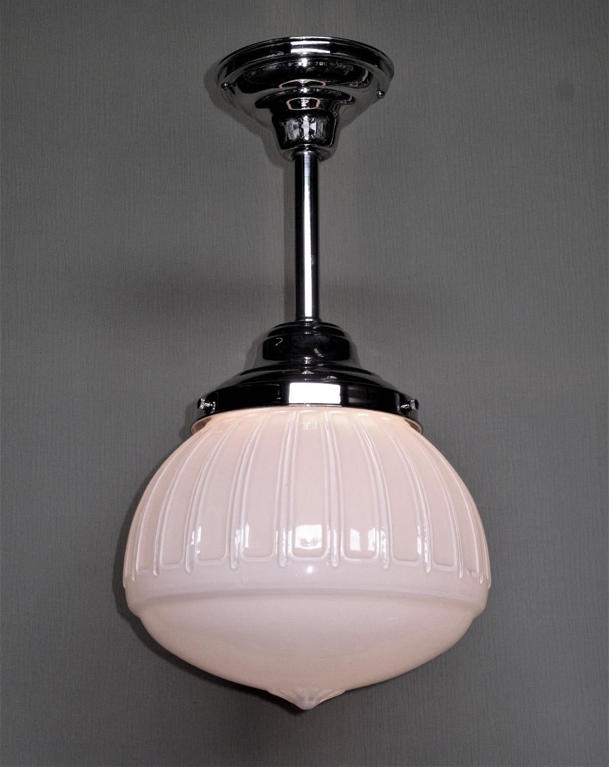 Very pleasing design.
Early commercial globe shown on new polished Nickel fitters. The globes have a modified Acorn design, including the crown of the acorn showing through the husk. A classic design for today's modern kitchen or master bath, or a