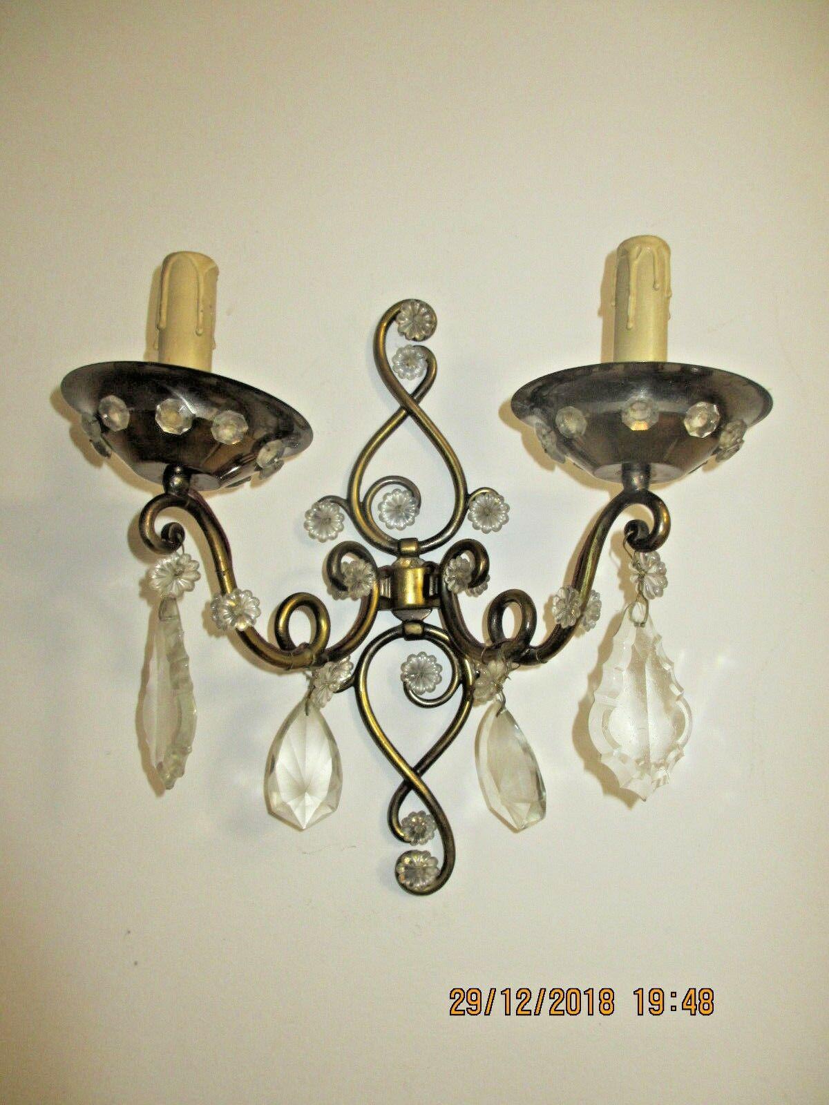 Beautiful Pair of French Art Deco Cut Crystal/ Finished Iron Wall Sconces. Attribution Maison Bagues. These sconces came out of a beautiful residence in Paris.