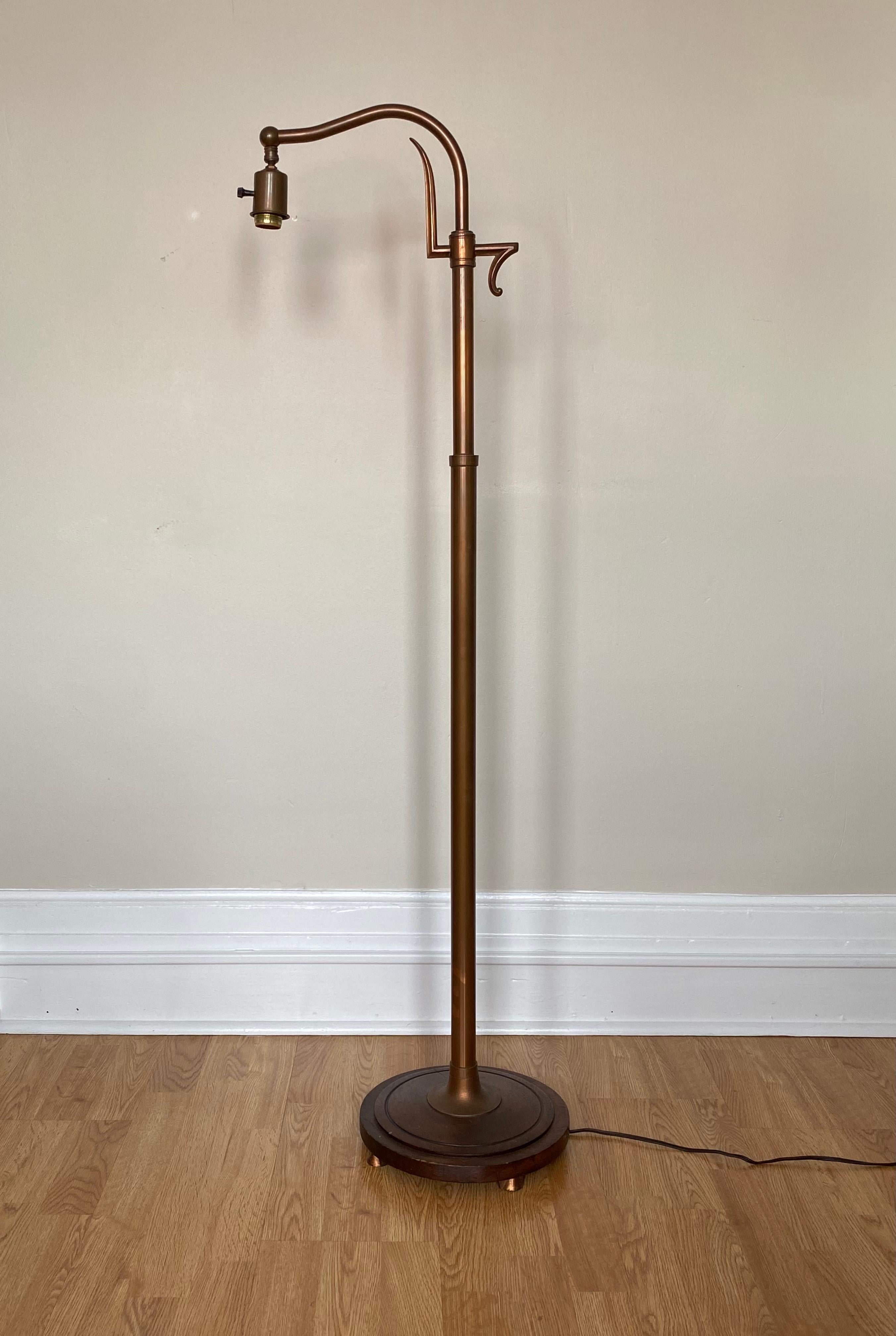A unique late 1920s copper and walnut floor lamp by FrankArt (Arthur von Frankenberg) of NYC. This lamp features a warm, overall patina to both the copper surfaces and wood. The lamp features a dynamic design with spear-like points at the top of the