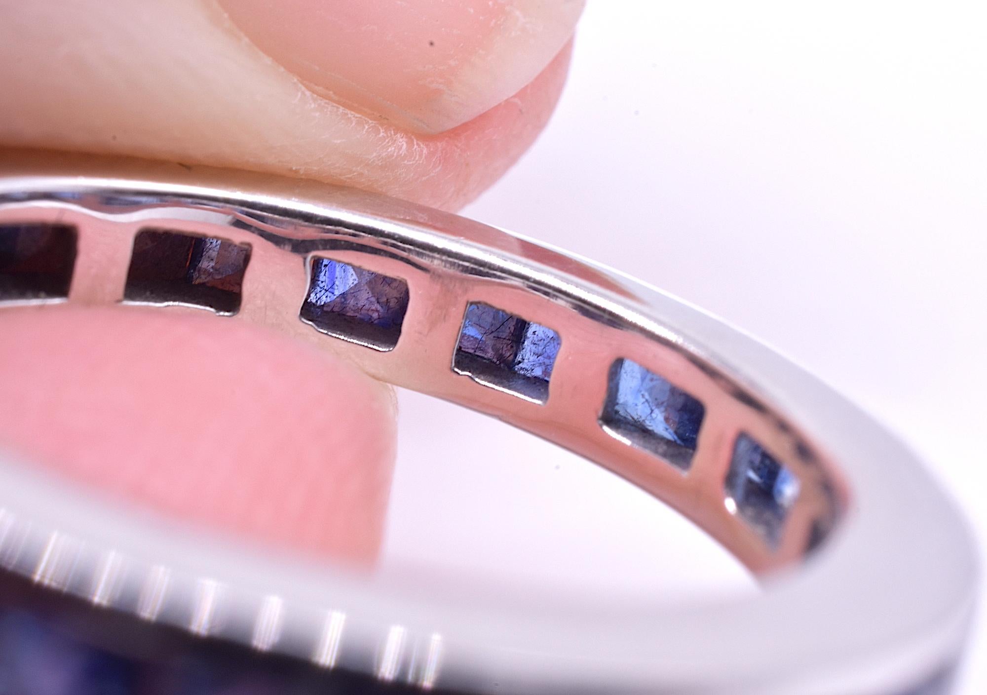 Our Art Deco sapphire eternity band is crafted with a polished white gold band of 15K. Eternity bands were symbolic of never ending love and devotion, often given on the occasion of an engagement, wedding, birth of a child, or anniversary. The ring