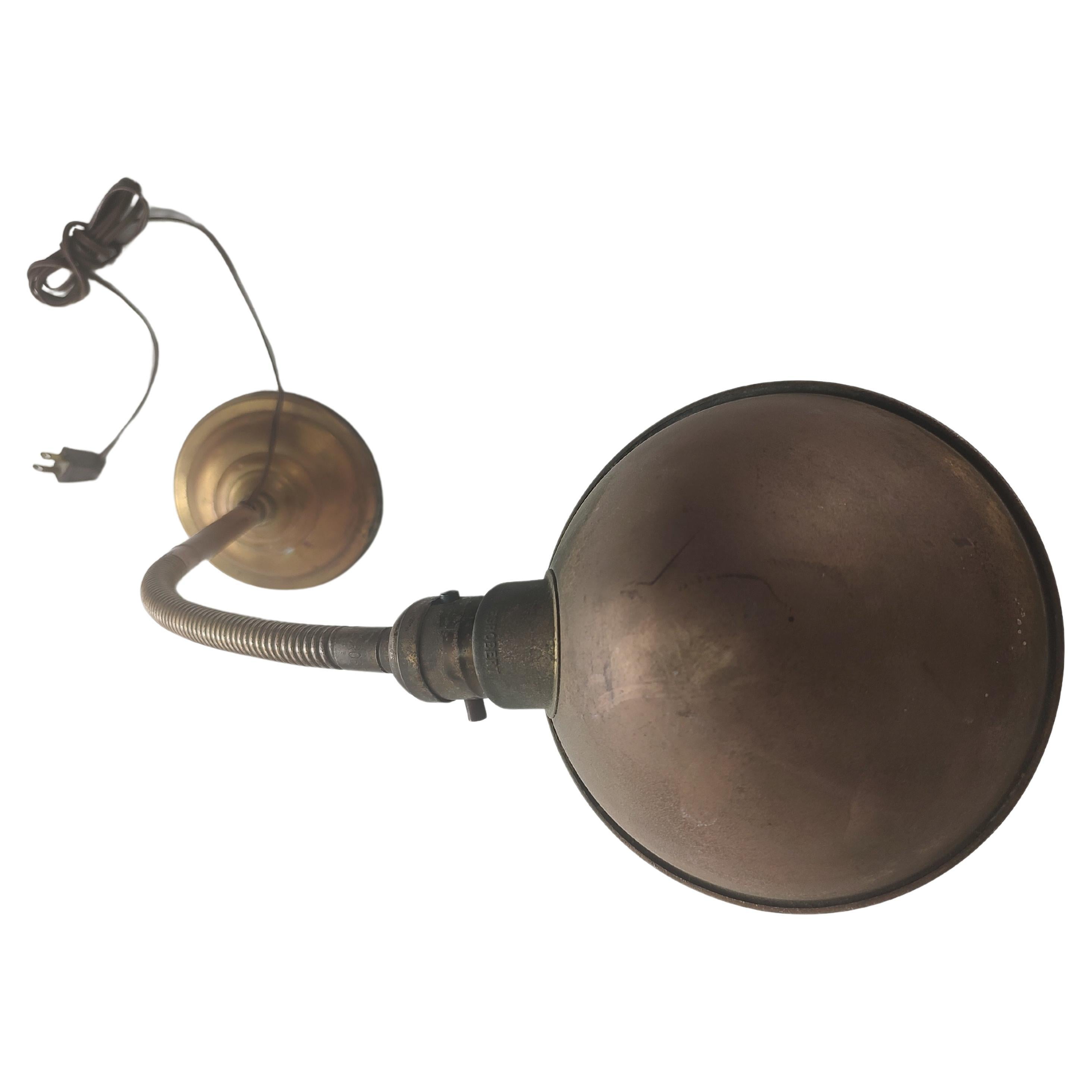 Early Gooseneck Desk Task Lamp, completely adjustable with new wiring. Brass copper with a weighed base of cast iron. In tarnished condition, lots of patina.