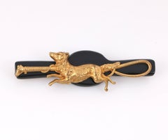 Broche en or à motif de chasse en forme de renard de course et d'équitation en bakélite noire, années 1930