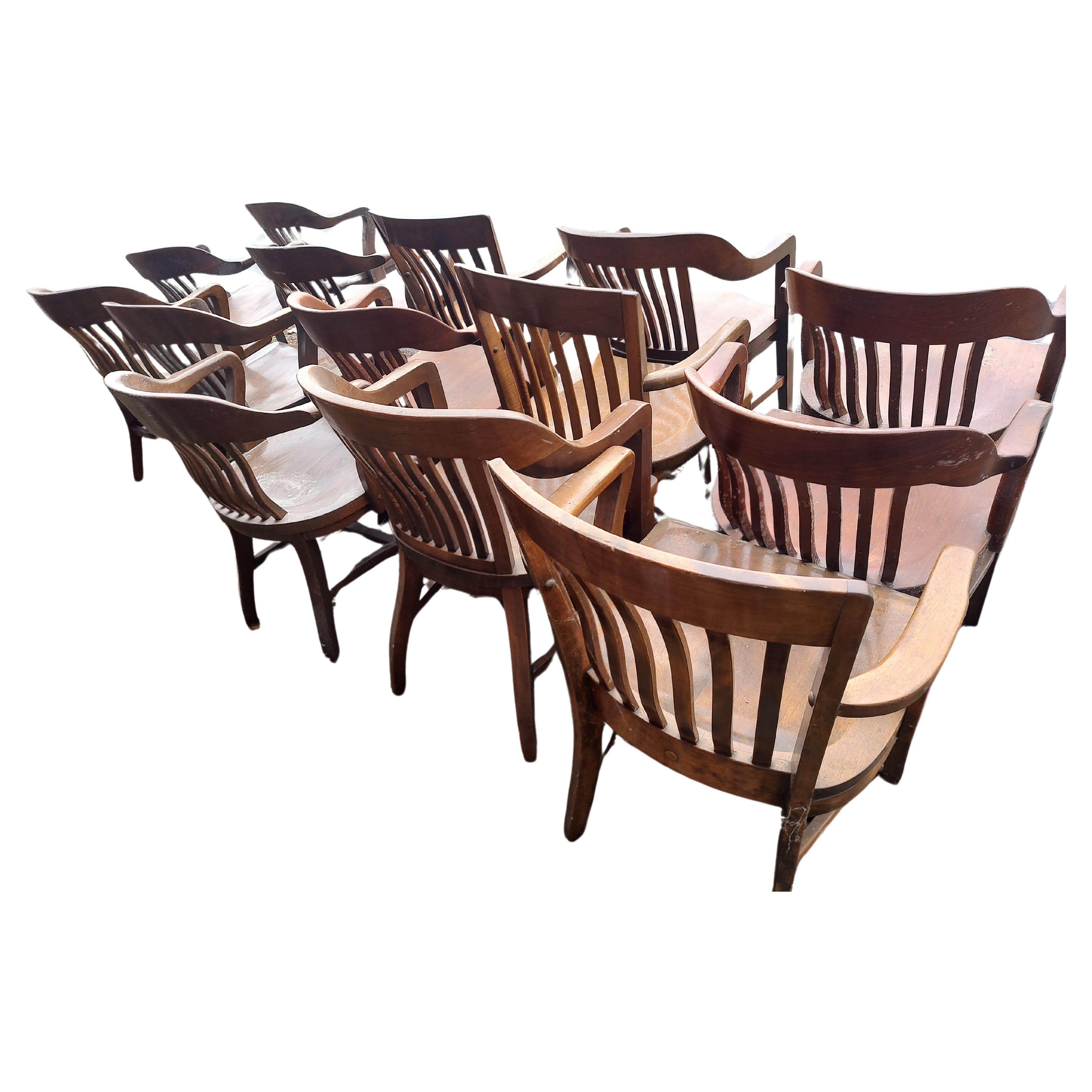 Fabulous collection of hardwood bankers chairs often found in offices, jury rooms, conference centers etc. Created from oak maple and walnut these chairs are heavy duty quality seating, great for a dining area. 3 chairs available and have some