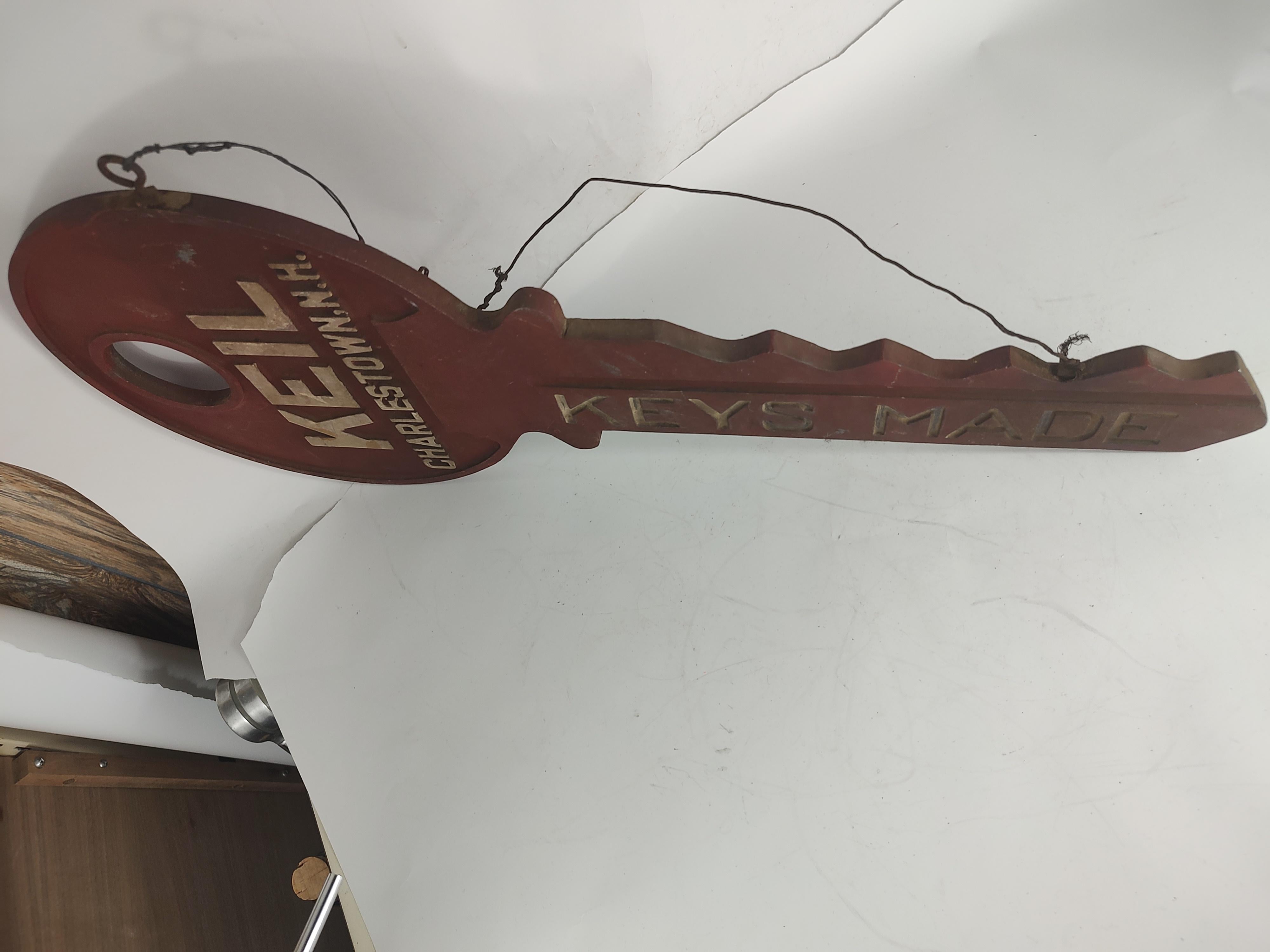 Fabulous cast aluminum trade sign circa 1945 depicting a actual key in red and silver. Perfect casting which retains its true color and material. Keil from Charlestown N.H. cast into the key along with 