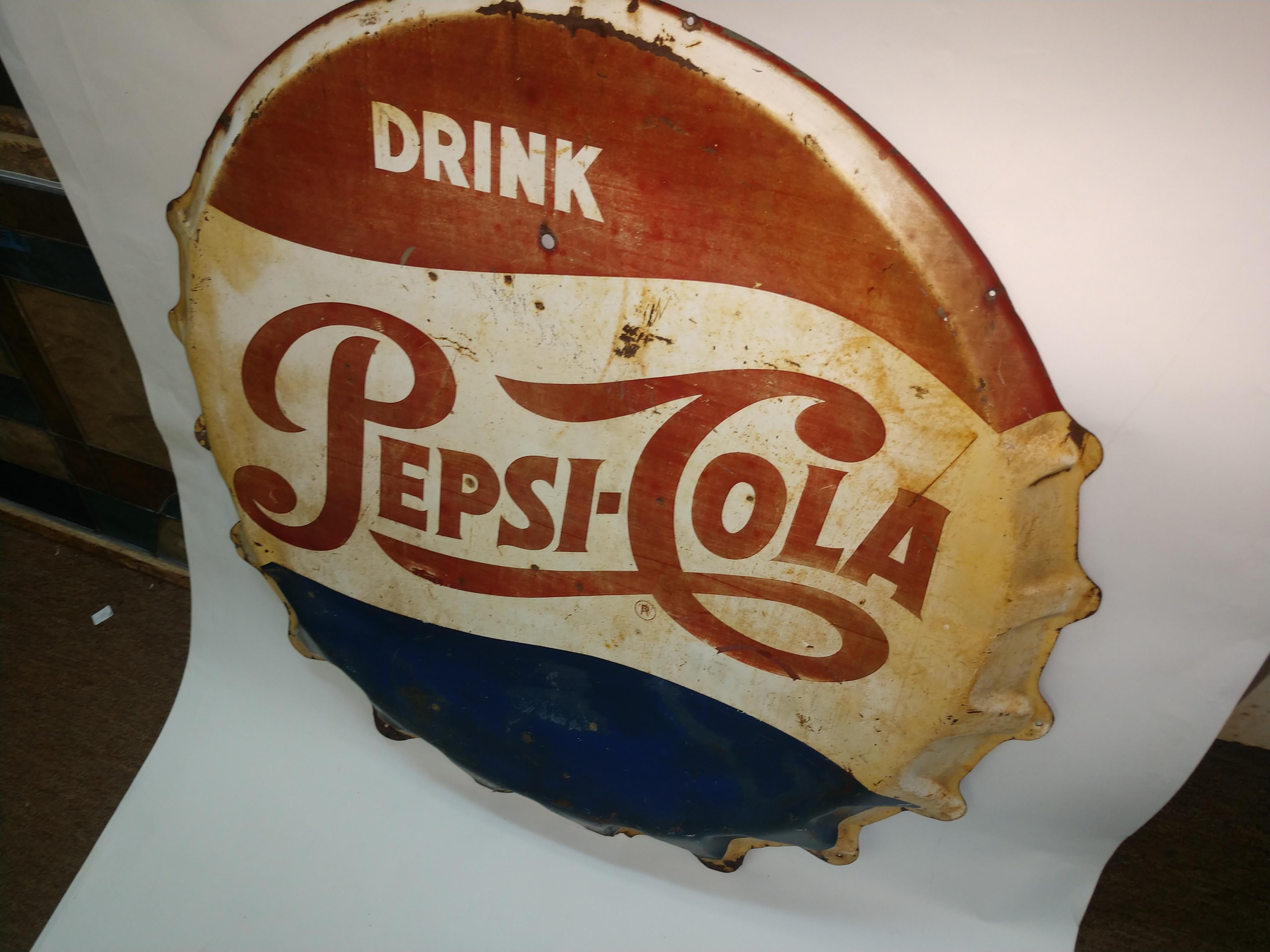 Fabulous blast from the past, red white & blue pepsi tin bottle cap sign by the Stout sign co. St Louis Missouri. A little faded and some rust due to age and normal wear. This item can be parcel posted.