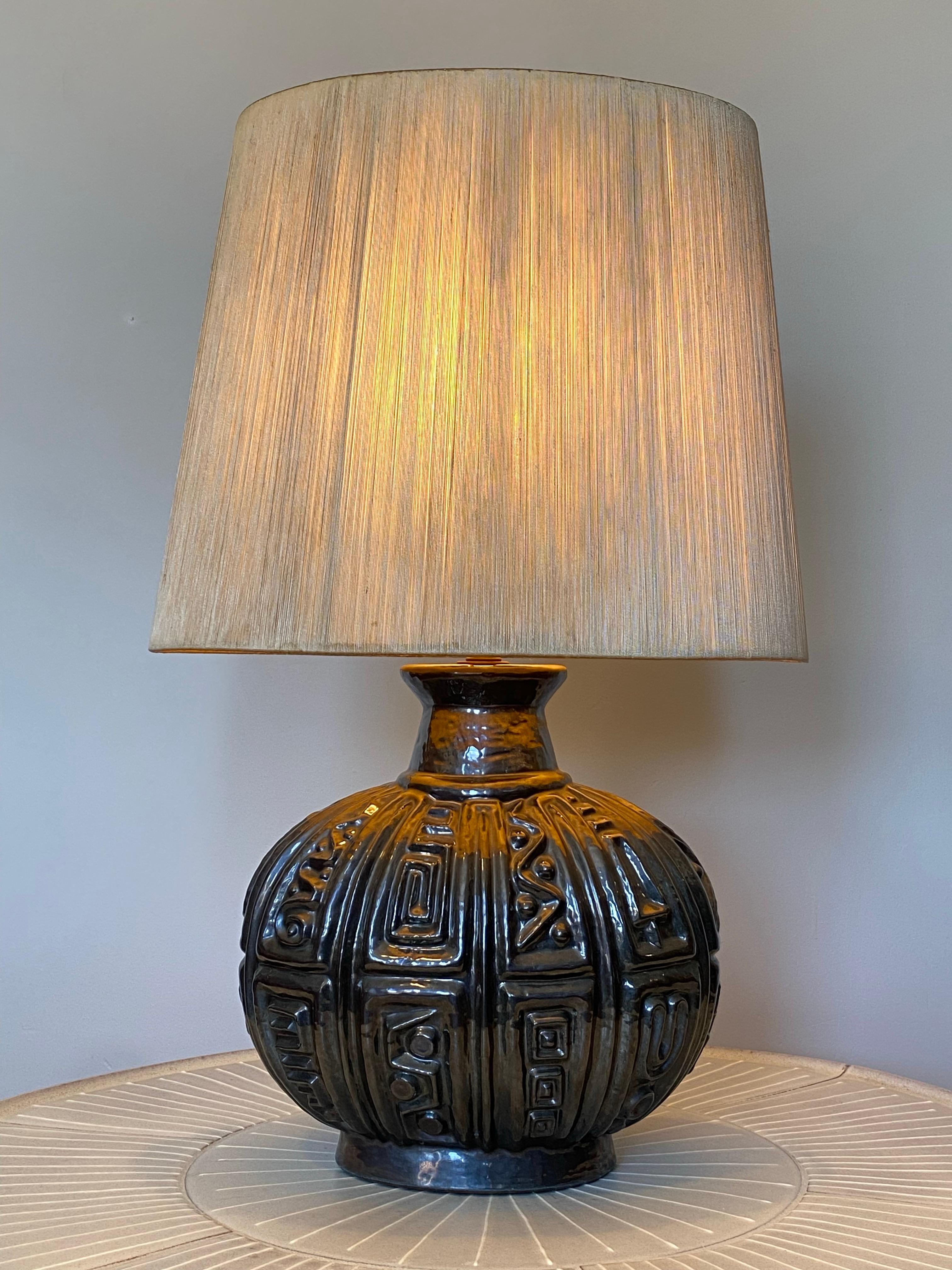A c1960 Lee Rosen for Design-Technics Brutalist Pottery Lamp featuring its original, oval string shade. This lamp appears in the Design-Technics catalog as Style: CL 385 (Ovoid) Technic: Sculptured.  This particular model is one of the largest