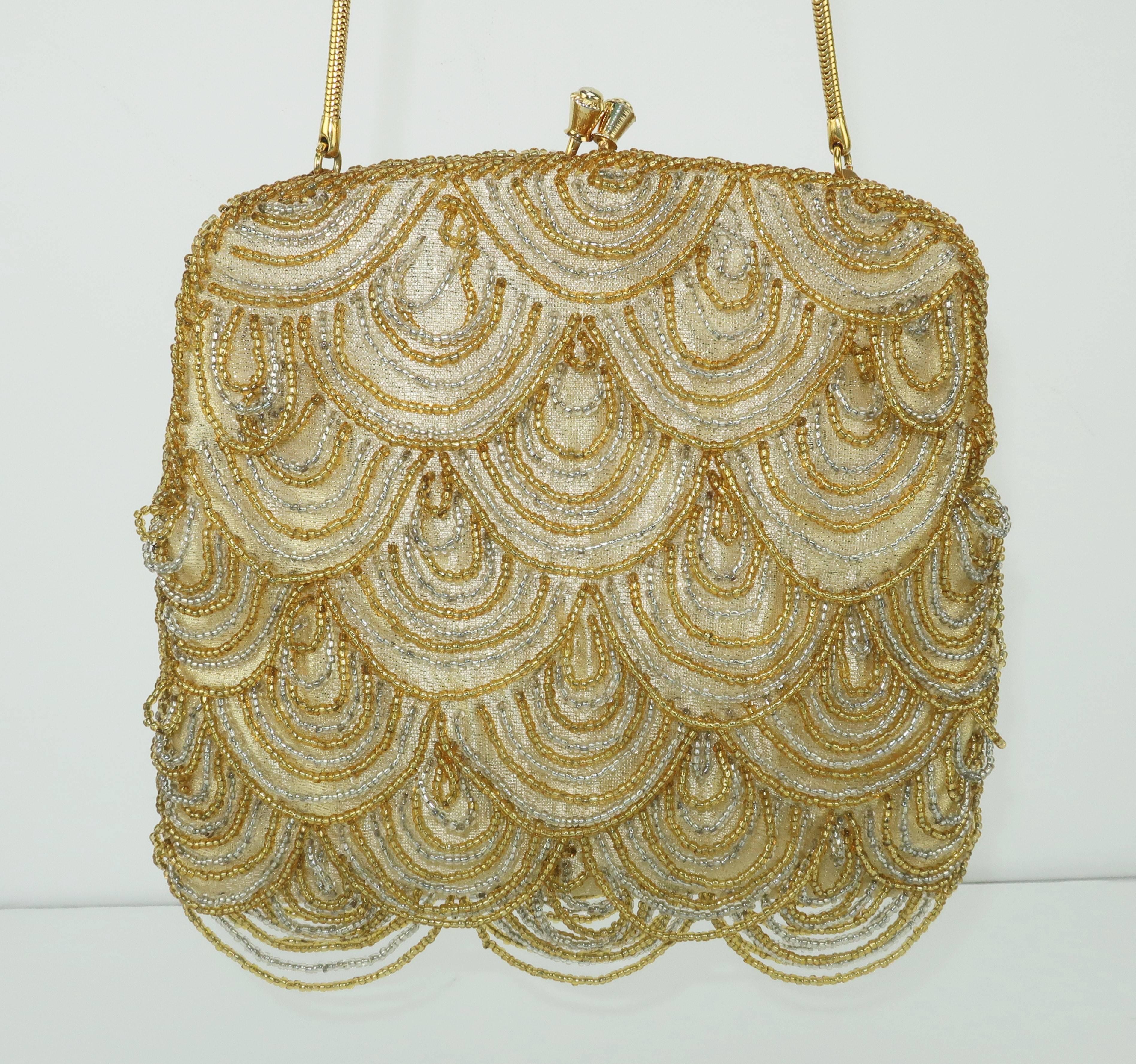 Hilde Walborg founded her company in the 1940's and was always in search of the best handmade beading for her designs.  This glamorous evening handbag combines an art deco aesthetic with a 1960’s vibe.  The gold tone metal frame supports a drop-in